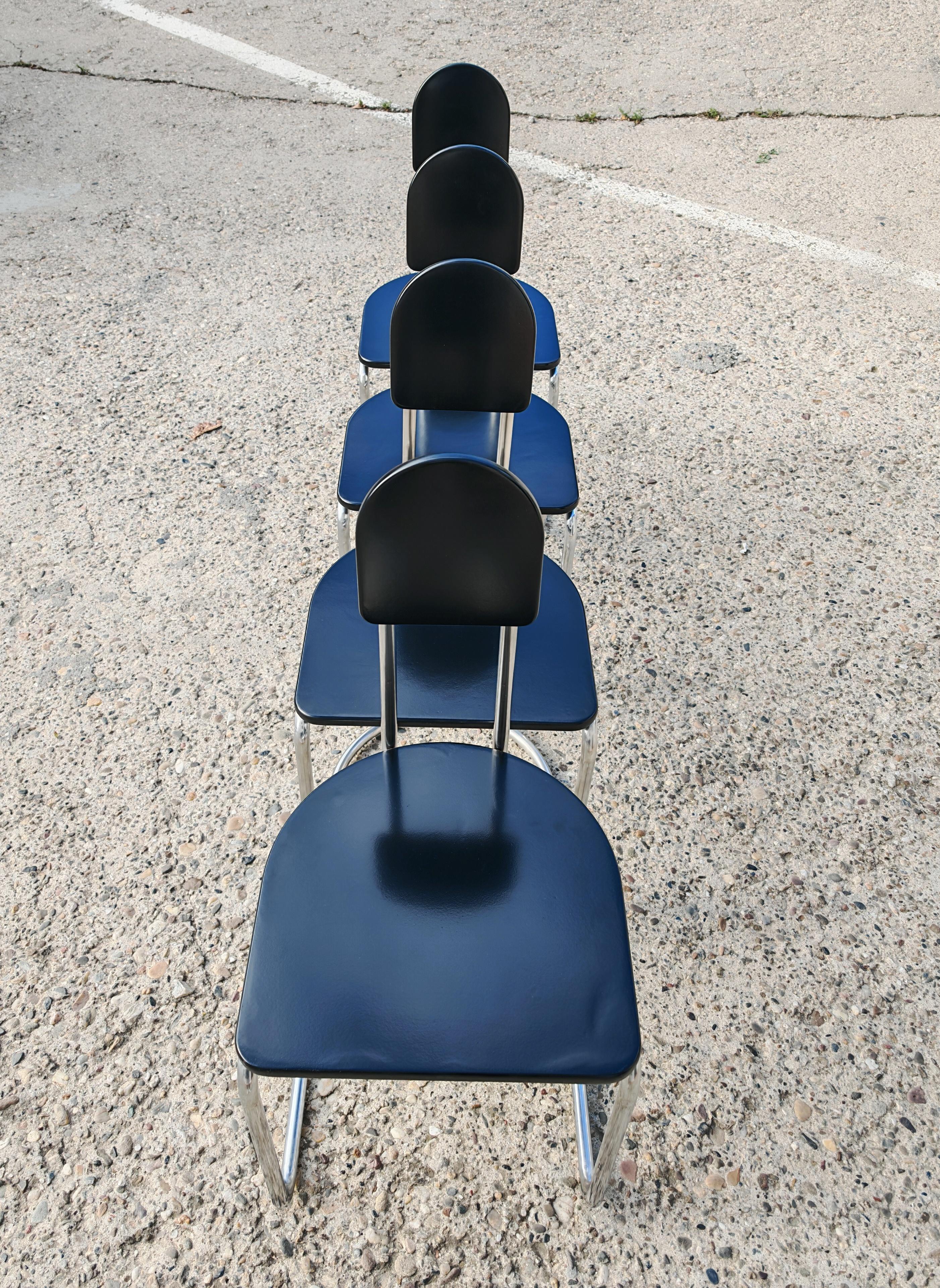 Late 20th Century Set of 4 Bauhaus Chairs with tubular steel frames and black lacquer wood seats For Sale