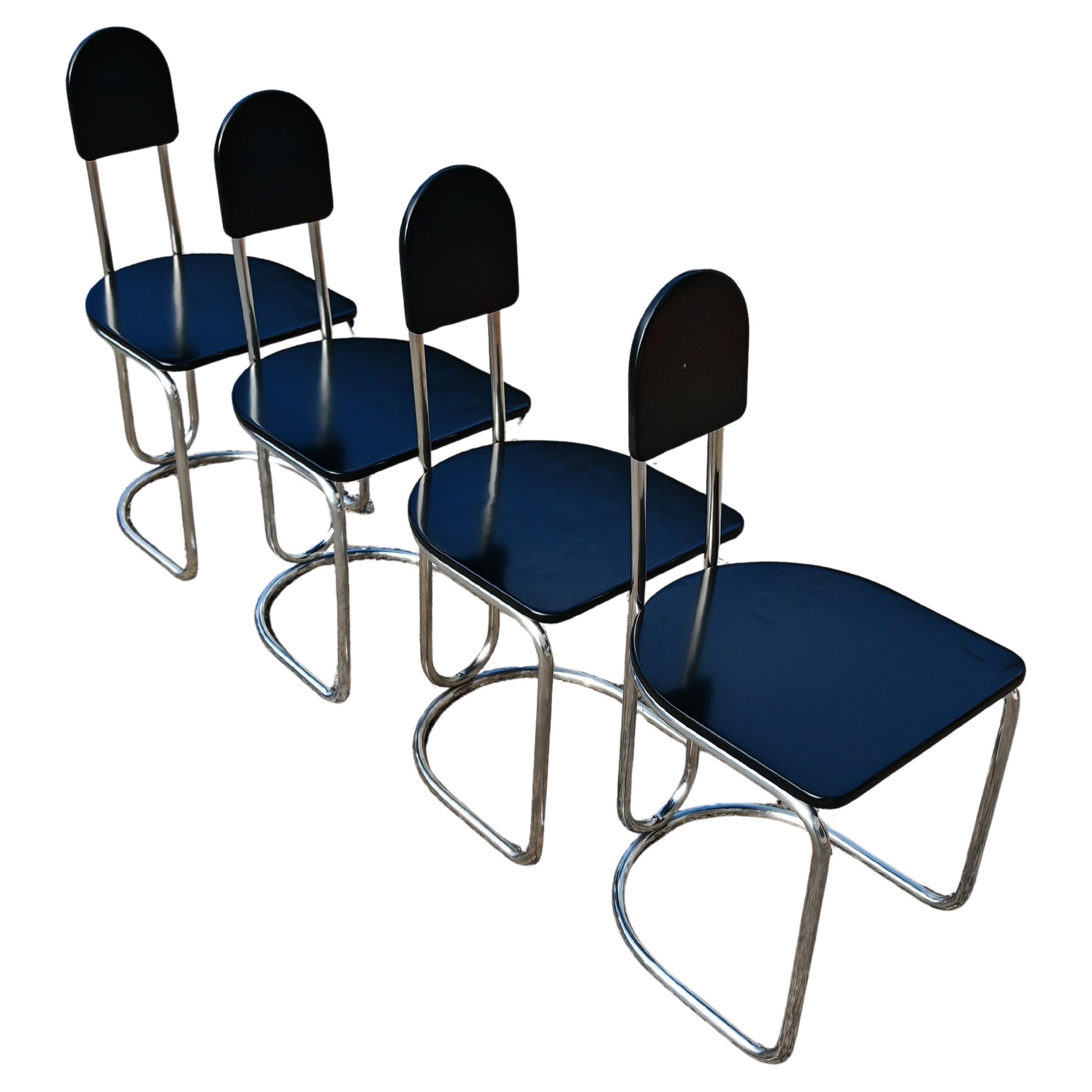 Set of 4 Bauhaus Chairs with tubular steel frames and black lacquer wood seats