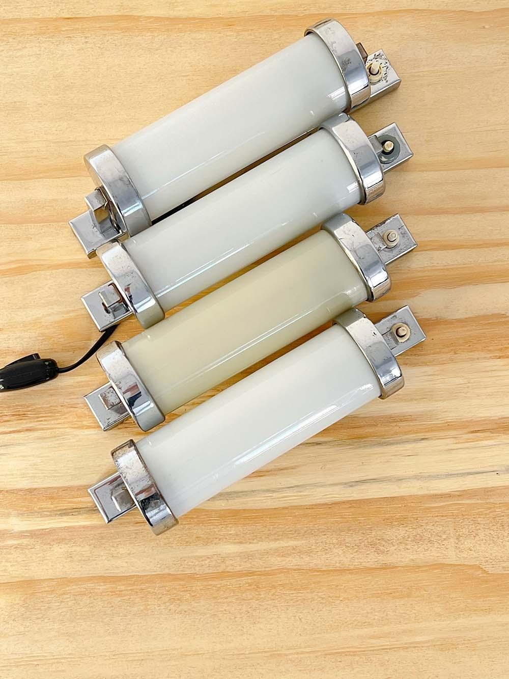 Set of 4 Bauhaus chrome-plated steel tubular wall lamps made by Napako in Czechoslovakia, 1940s.

Each of these beautiful lamps made by the famous Czech manufacturer Napako features a chrome-plated steel structure and their instantly recognizable