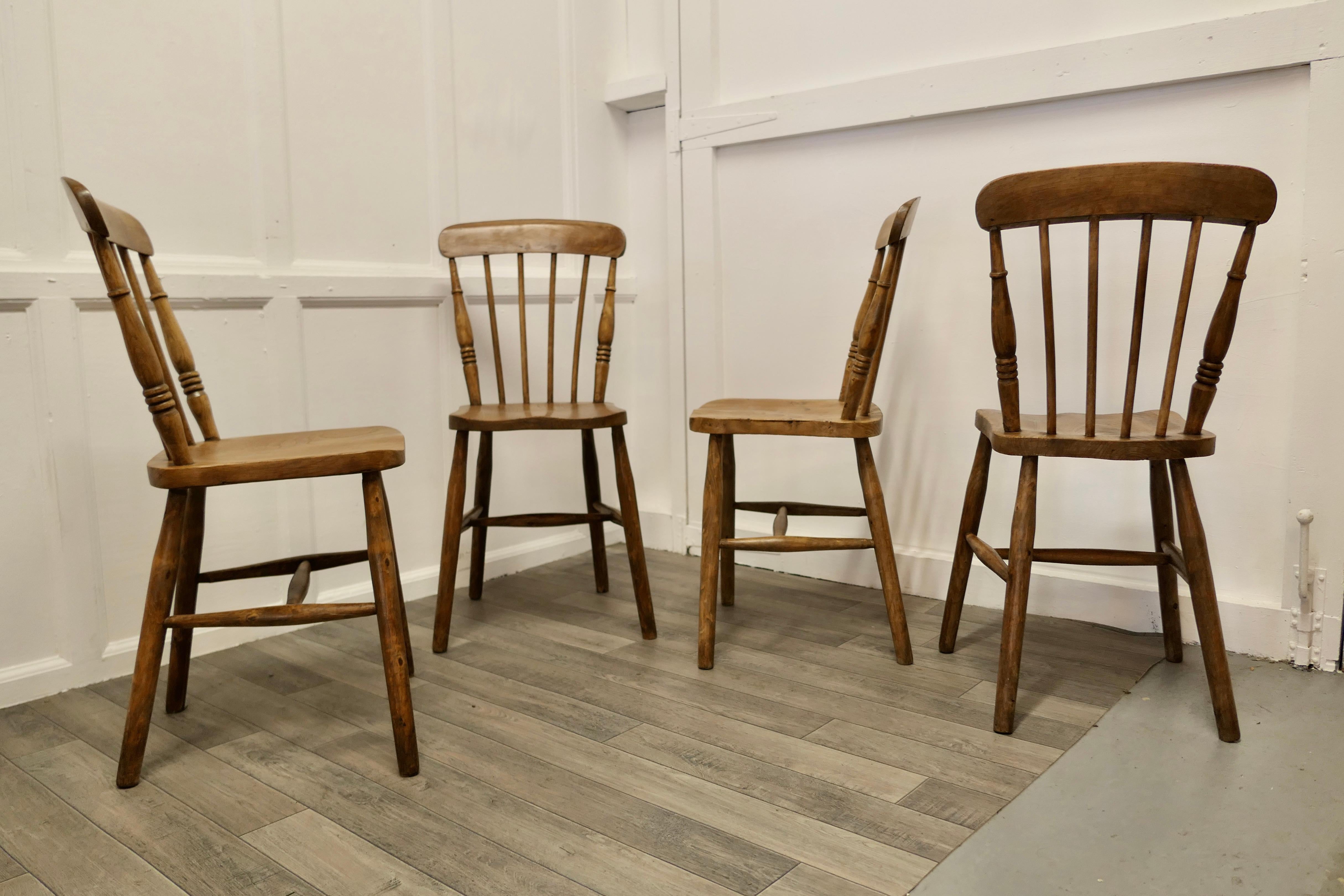 Early 20th Century Set of 4 Beech and Elm Seated Stick Back Kitchen Dining Chairs For Sale