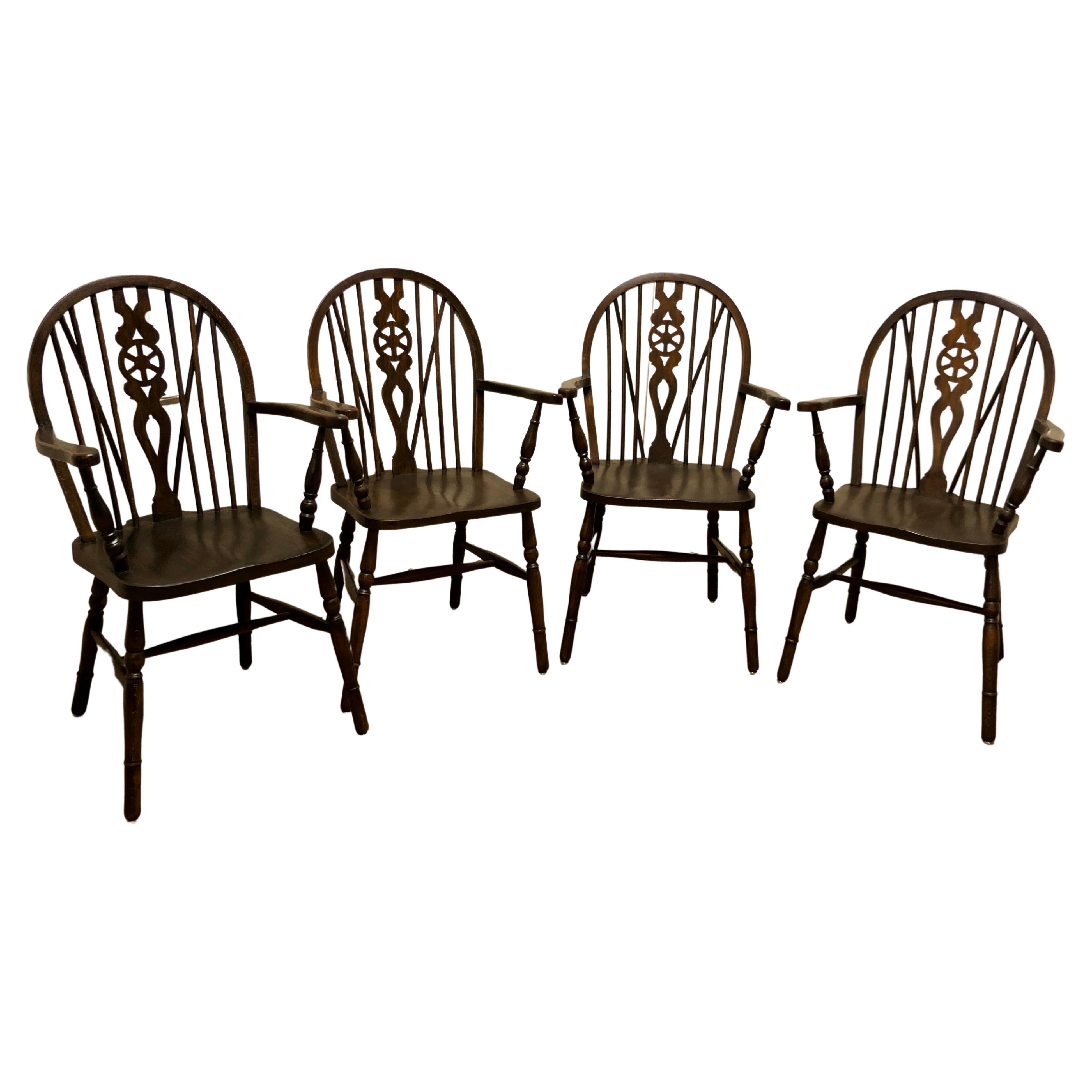 Set of 4 Beech and Elm Wheel Back Carver Chairs