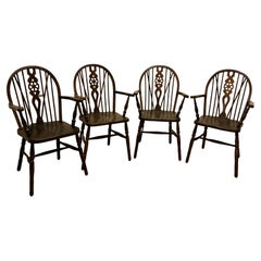 Set of 4 Beech and Elm Wheel Back Carver Chairs