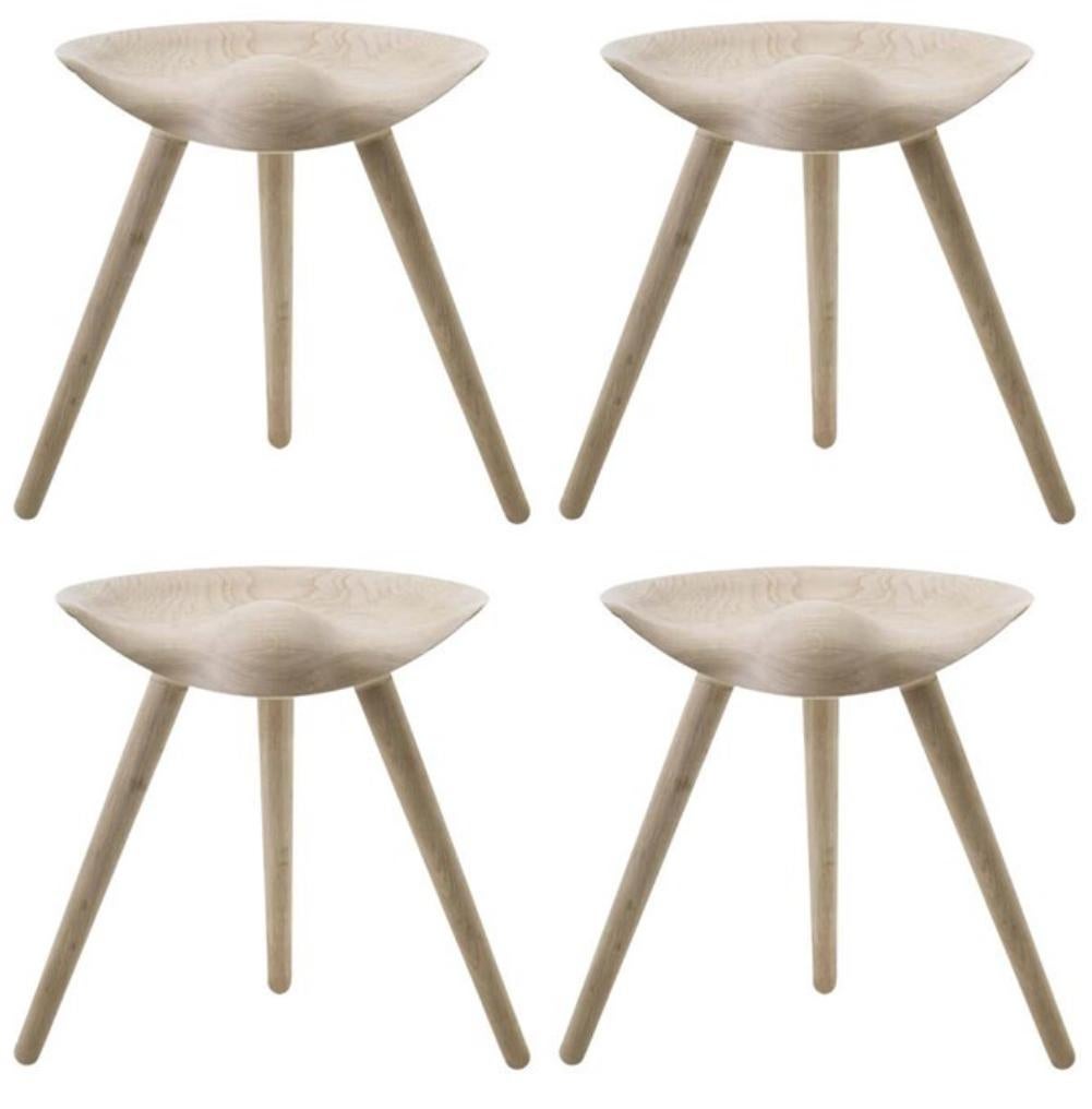 Set Of 4 ML 42 beige oak stools by Lassen.
Dimensions: H 48 x W 36 x L 55.5 cm.
Materials: Oak.

In 1942 Mogens Lassen designed the Stool ML42 as a piece for a furniture exhibition held at the Danish Museum of Decorative Art. He took inspiration