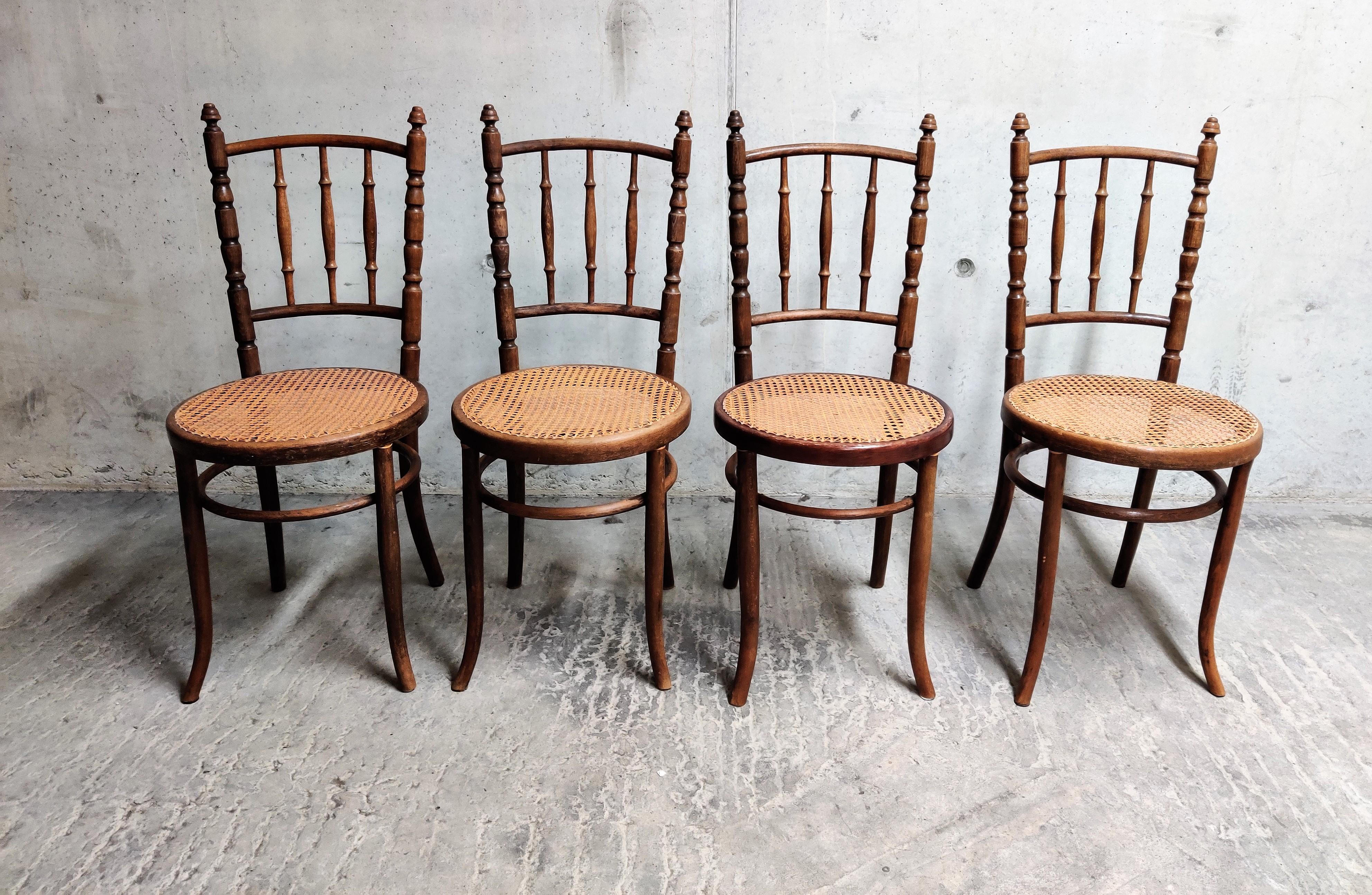 Set of 4 unique bentwooden dining chairs. 

This chairs were made in the 1930s by Jacob U. Josef Kohn.

As you can see in the pictures, the chairs are very similar to the famous 'Thonet' chairs.

One of the chairs had a repair to regain