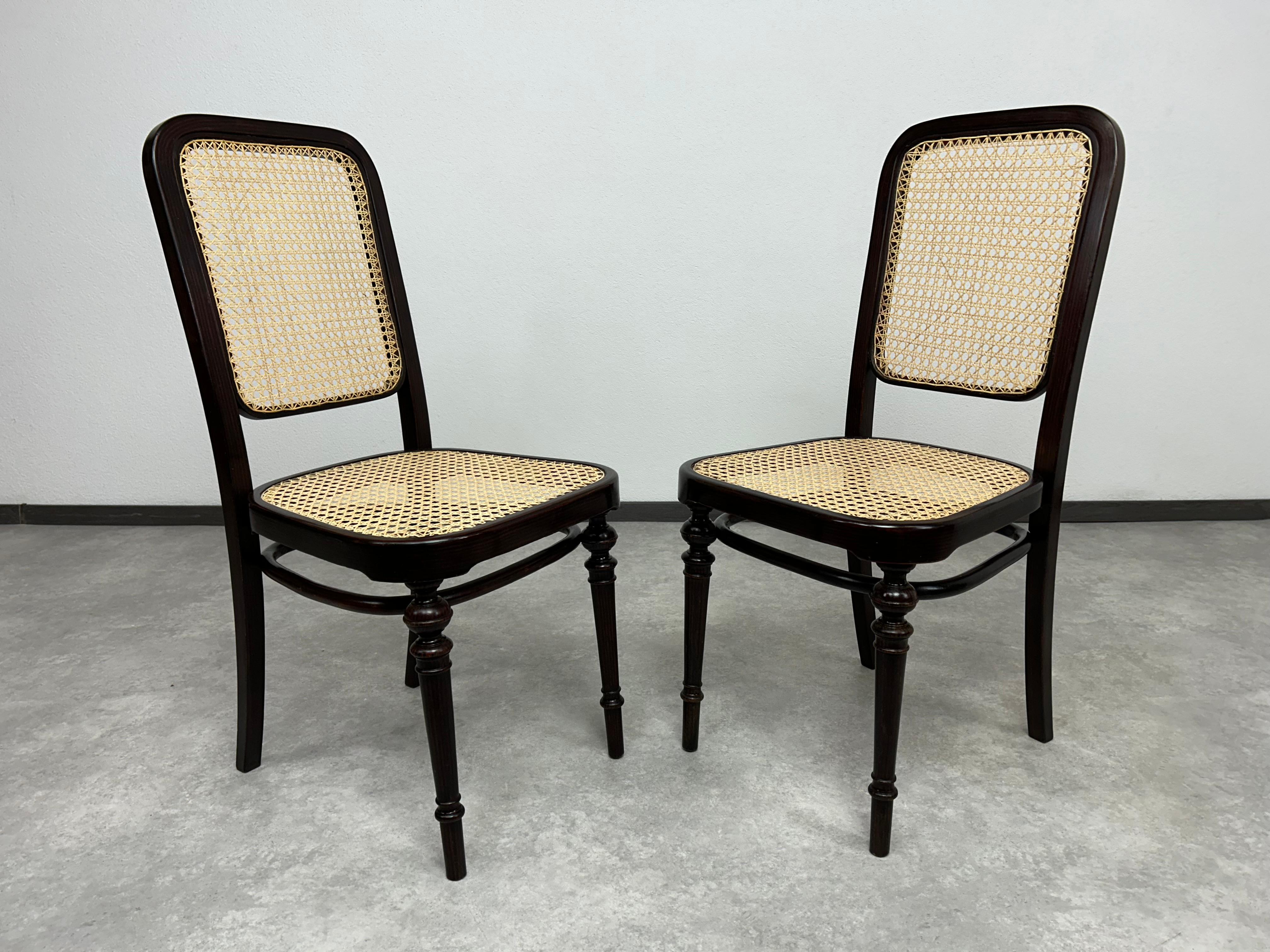Set of 4 bentwood dining room chairs by Thonet. Professionally stained and repolished with new handmade rattan seats.