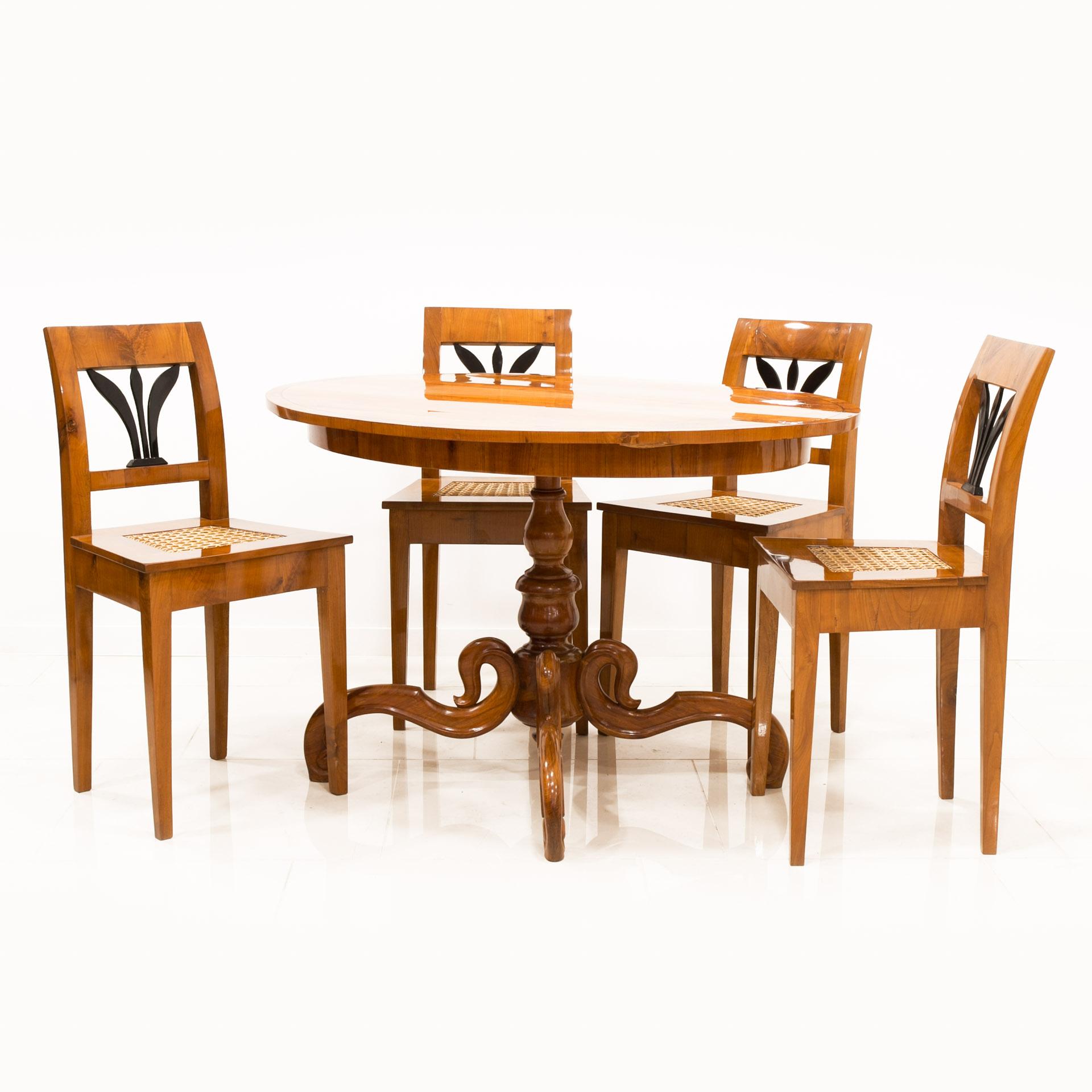 Set of four comfortable, original Biedermeier style chairs manufactured in Austria in 1st half on the 19th century. They are made of cherry wood, while the seats are made of a characteristic Viennese weave. Chairs are professionally renovated.