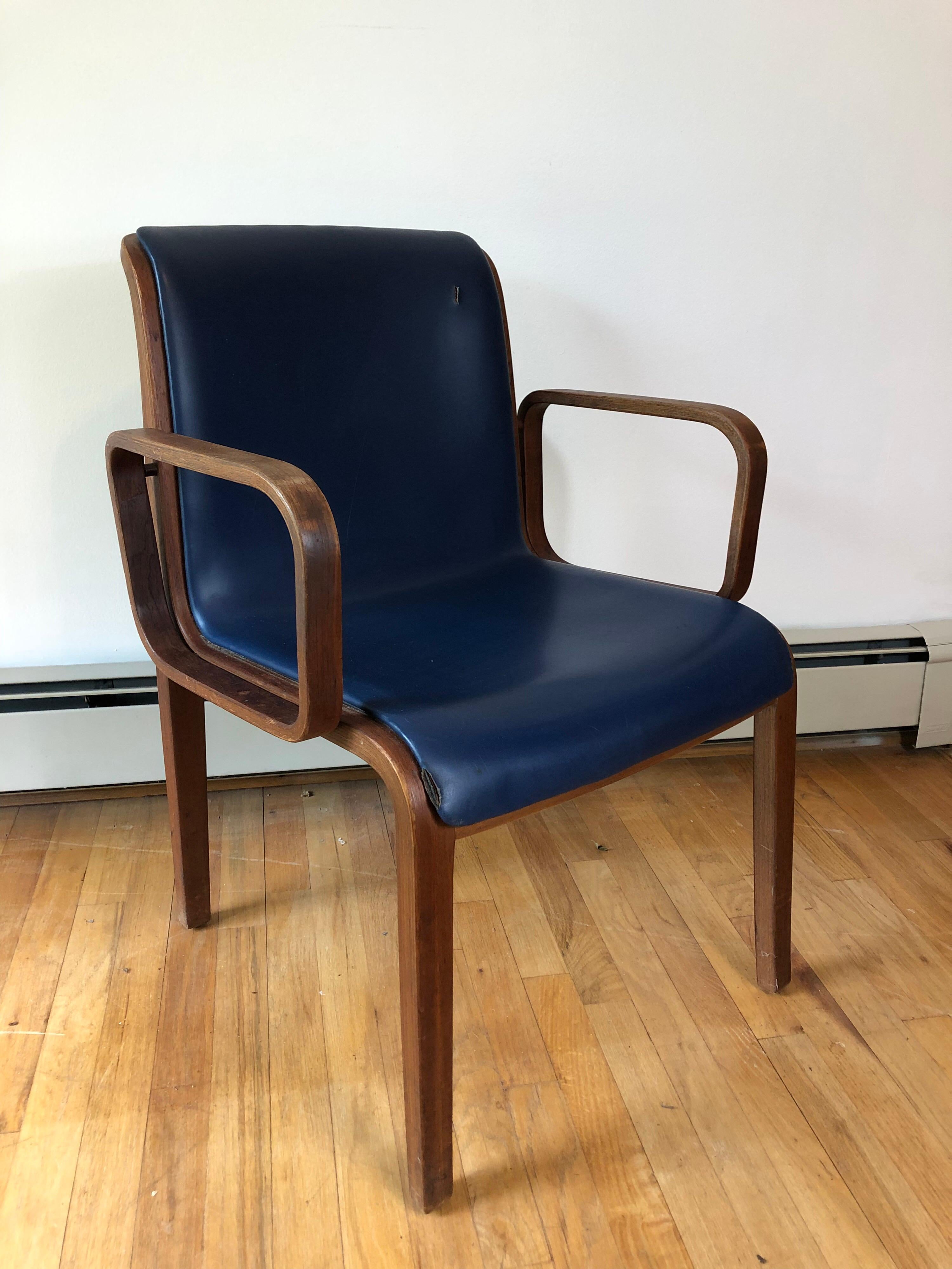 A set of four Bill Stephens for knoll armchairs in dark stained bentwood oak frames. Ready for reupholstery.