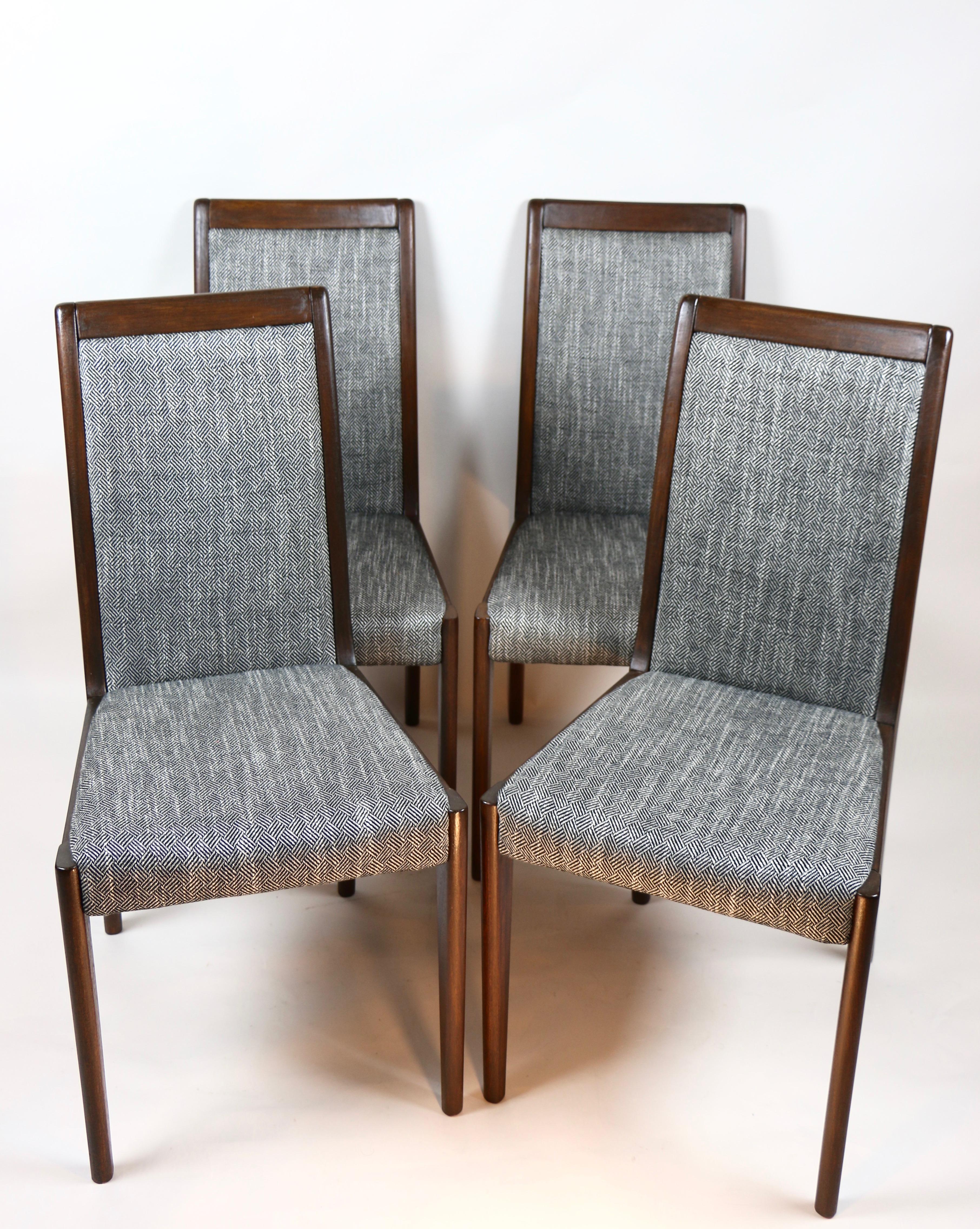 Set of 4 German Casala chairs in black and white natural fabric from 1980s, completely restored, new upholstery covered with fabric in herringbone fashionable color.
Headquarters has received new upholstery covered. Wooden elements finished with