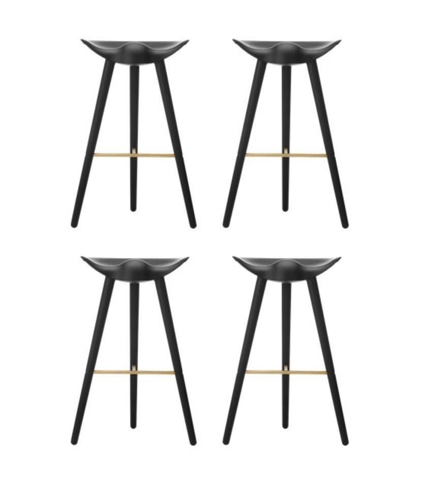 Set Of 4 Black Beech and Brass Bar Stools by Lassen
Dimensions: H 77 x W 36 x L 55.5 cm
Materials: Beech, Brass

In 1942 Mogens Lassen designed the Stool ML42 as a piece for a furniture exhibition held at the Danish Museum of Decorative Art. He