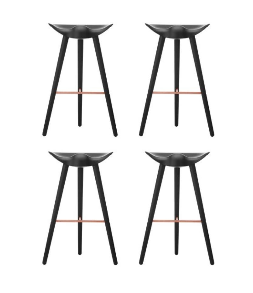 Set of 4 black beech and copper bar stools by Lassen
Dimensions: H 77 x W 36 x L 55.5 cm.
Materials: beech, copper.

In 1942 Mogens Lassen designed the Stool ML42 as a piece for a furniture exhibition held at the Danish Museum of Decorative Art.