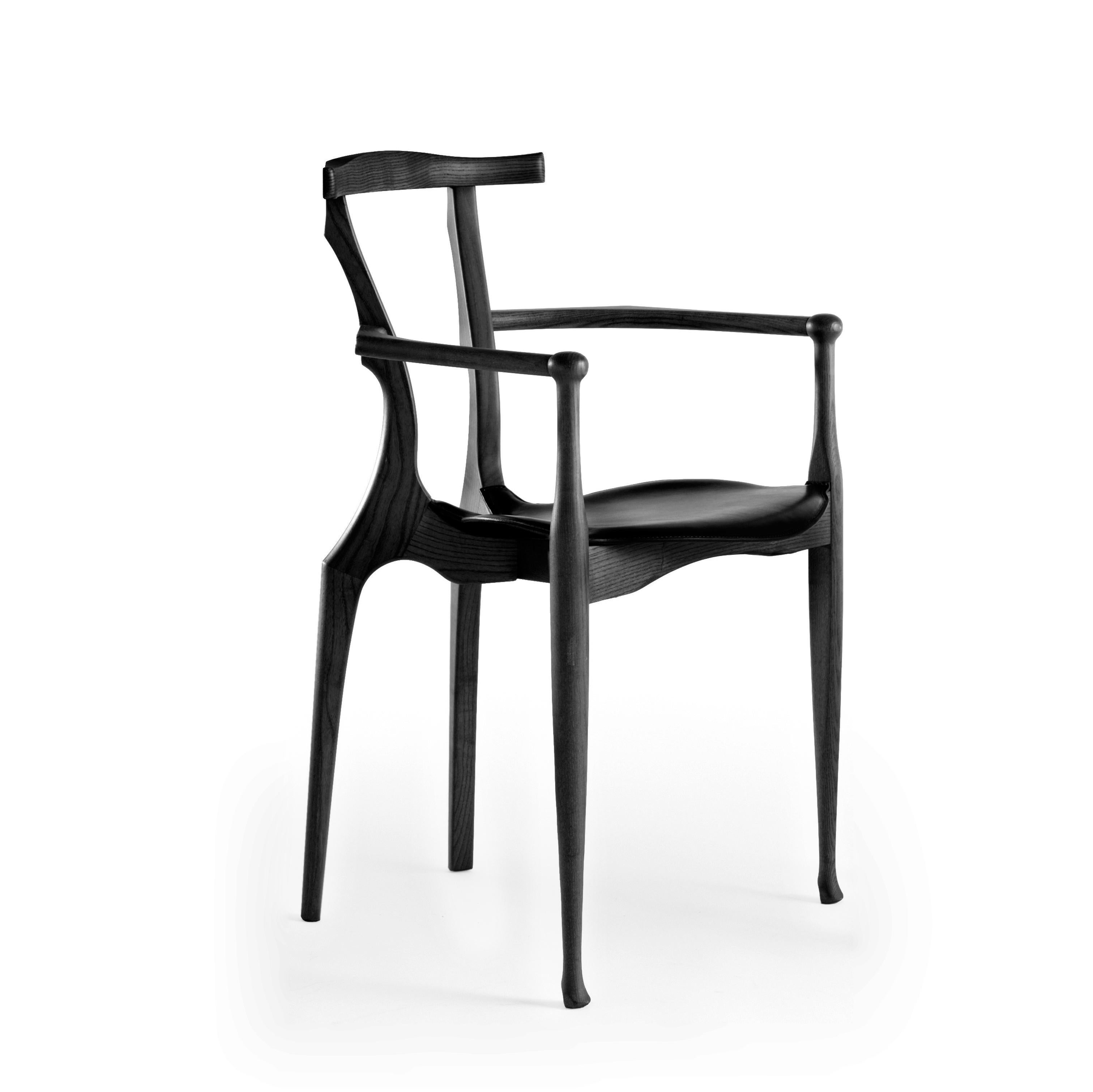 Solid ash lacquered in black with seat inn black hide
Set of four.

Gaulino chair designed by Oscar Tusquets manufactured by BD Barcelona Design, circa 2010.

Gaulino chair which, designed in 1987, was selected for the Industrial Design prize