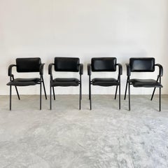 Satz von 4 schwarzen Jacques-Adnet-Stühlen