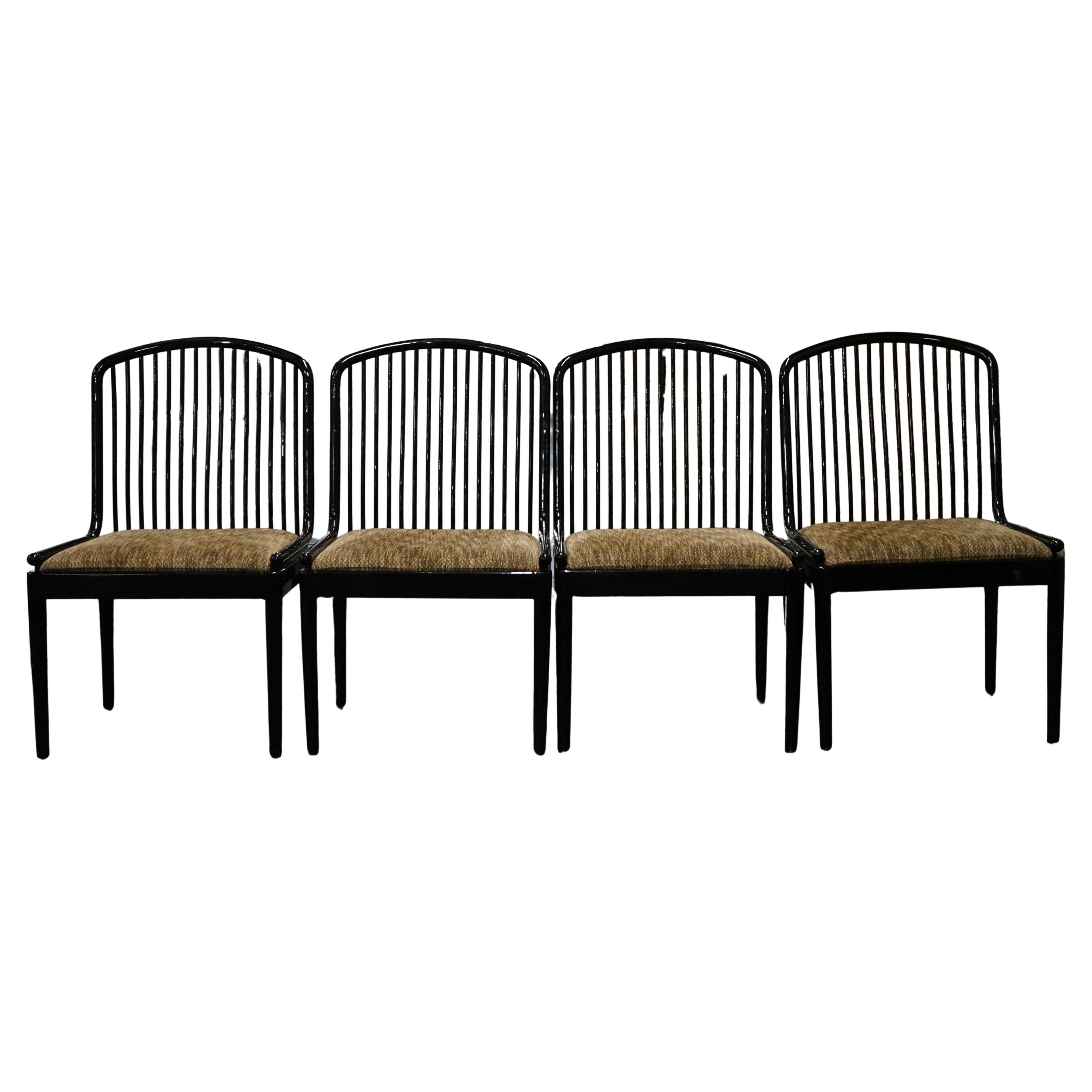 The Andover chair, designed by Davis Allen for Stendig, is a classic chair known for its blend of Danish Modern, Shaker, and Mission styles. It typically features a solid beech frame with a lacquered finish (often black which is the case with this