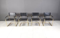 Set of 4 black leather and brass cantilever dining chairs - 1970s