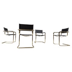 Set of 4 black leather and brass cantilever dining chairs - 1970s