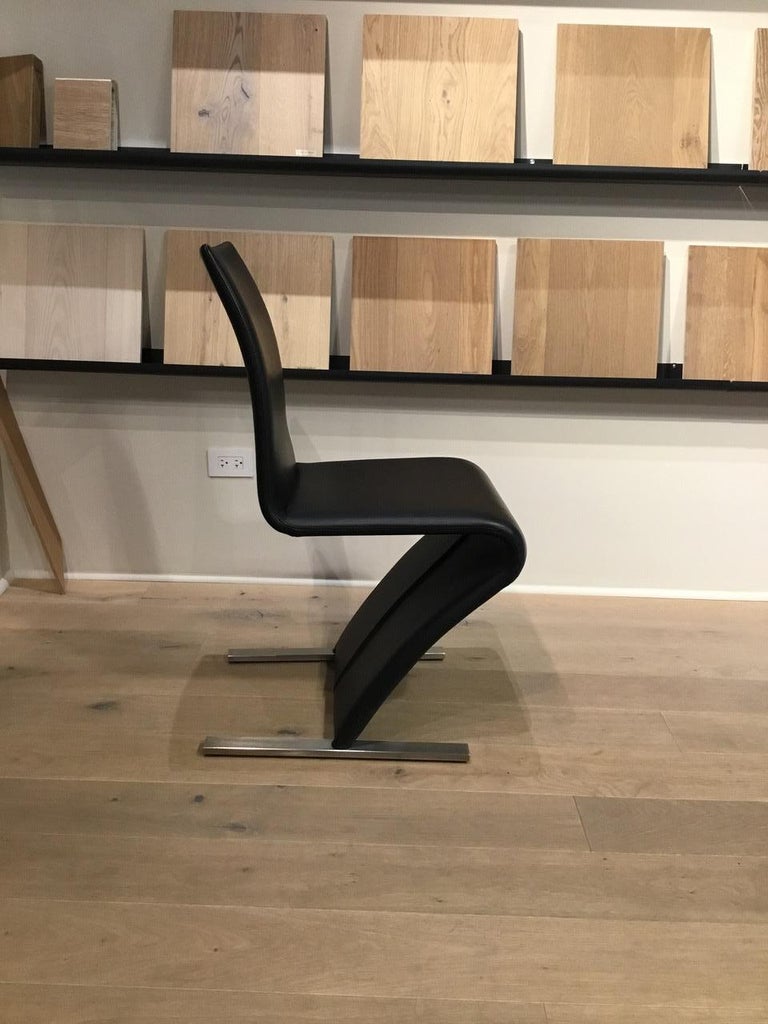 Set of 4 Black Leather Cantilevered Dining Chairs with Matt Chrome Feet