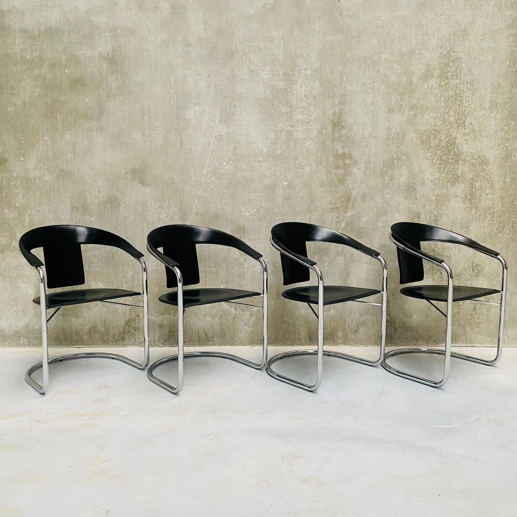 Introducing the stunning set of 4 black saddle leather and chrome frame dining chairs by A. RIZZATTO for LO STUDIO, a testament to exceptional Italian design from 1980.

Crafted with meticulous attention to detail, these dining chairs exude