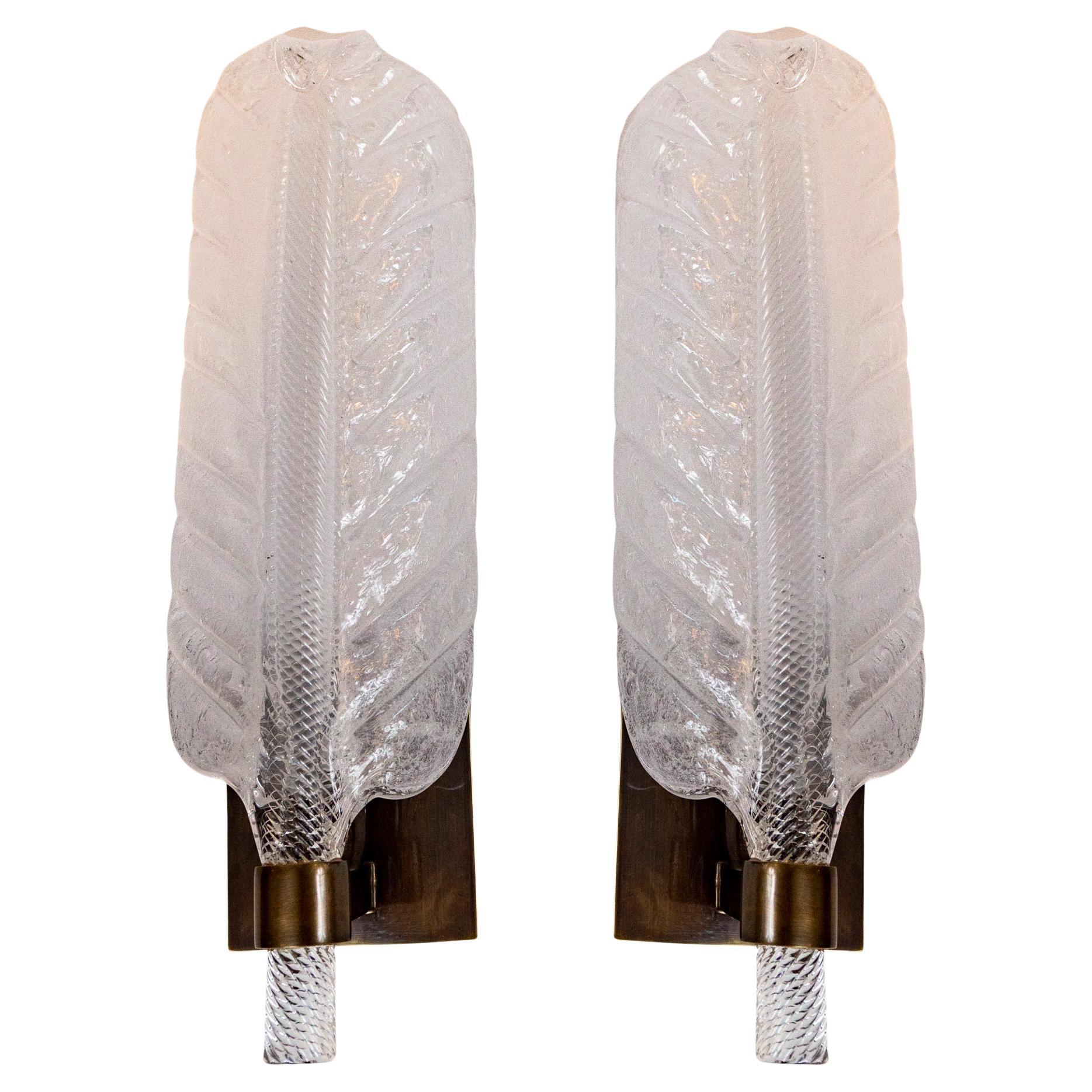 Smaller size frosted pulegoso style Murano blown wall lights with darkened brass fitting and wall plate.

Dating: Contemporary, commissioned work

 Illuminates with one candelabra bulb, UL Certified

Origin: Murano, Italy
Dimensions: overall