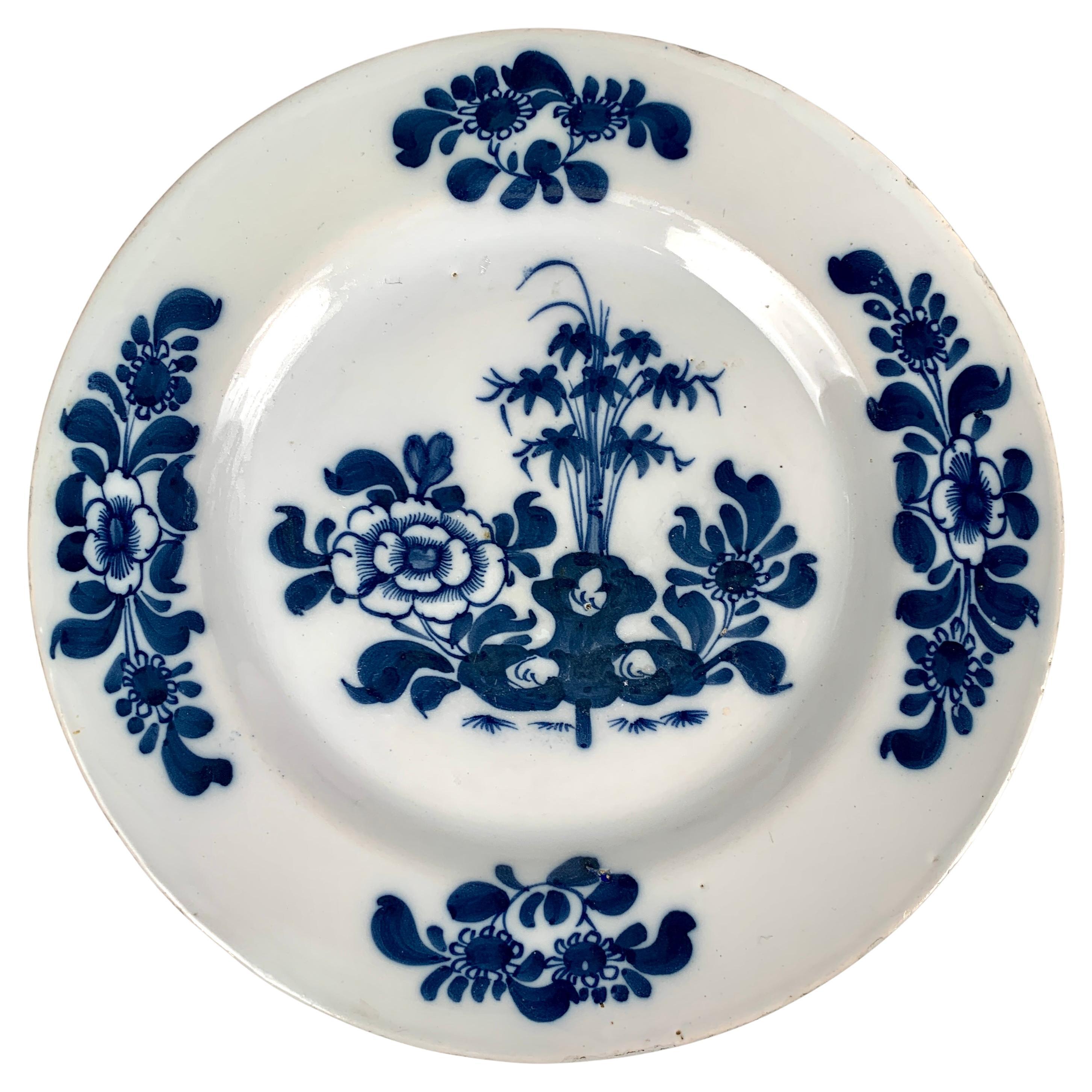 These exquisite hand-painted Delftware dishes, made in Bristol, England, circa 1760 and inspired by Chinese blue and white porcelain, are a perfect example of the mid-18th-century English Delftware artisans' skill and creativity. 
The deep cobalt