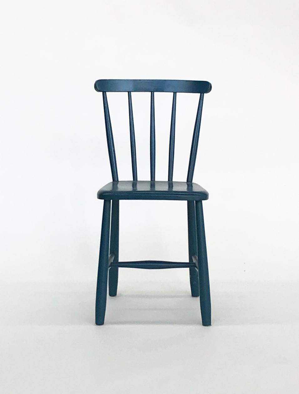 Set of four blue painted chairs.