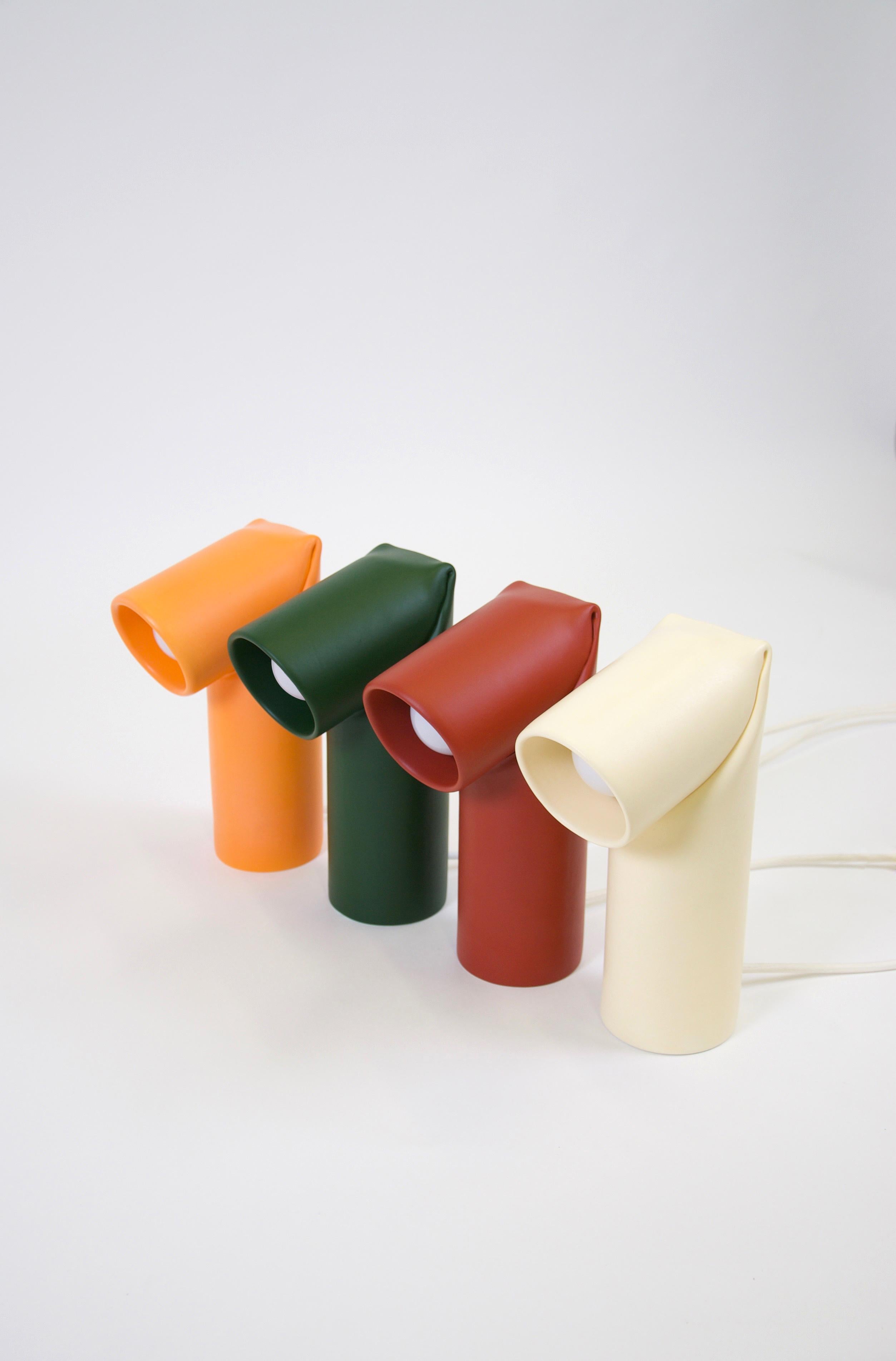 Set of 4 Bourrelet ceramic table lamps by Helder Barbosa
Materials: painted ceramic
Dimensions: 28 x 17 cm 
 Diameter: 9.5 cm
Different colors available.

All our lamps can be wired according to each country. If sold to the USA it will be