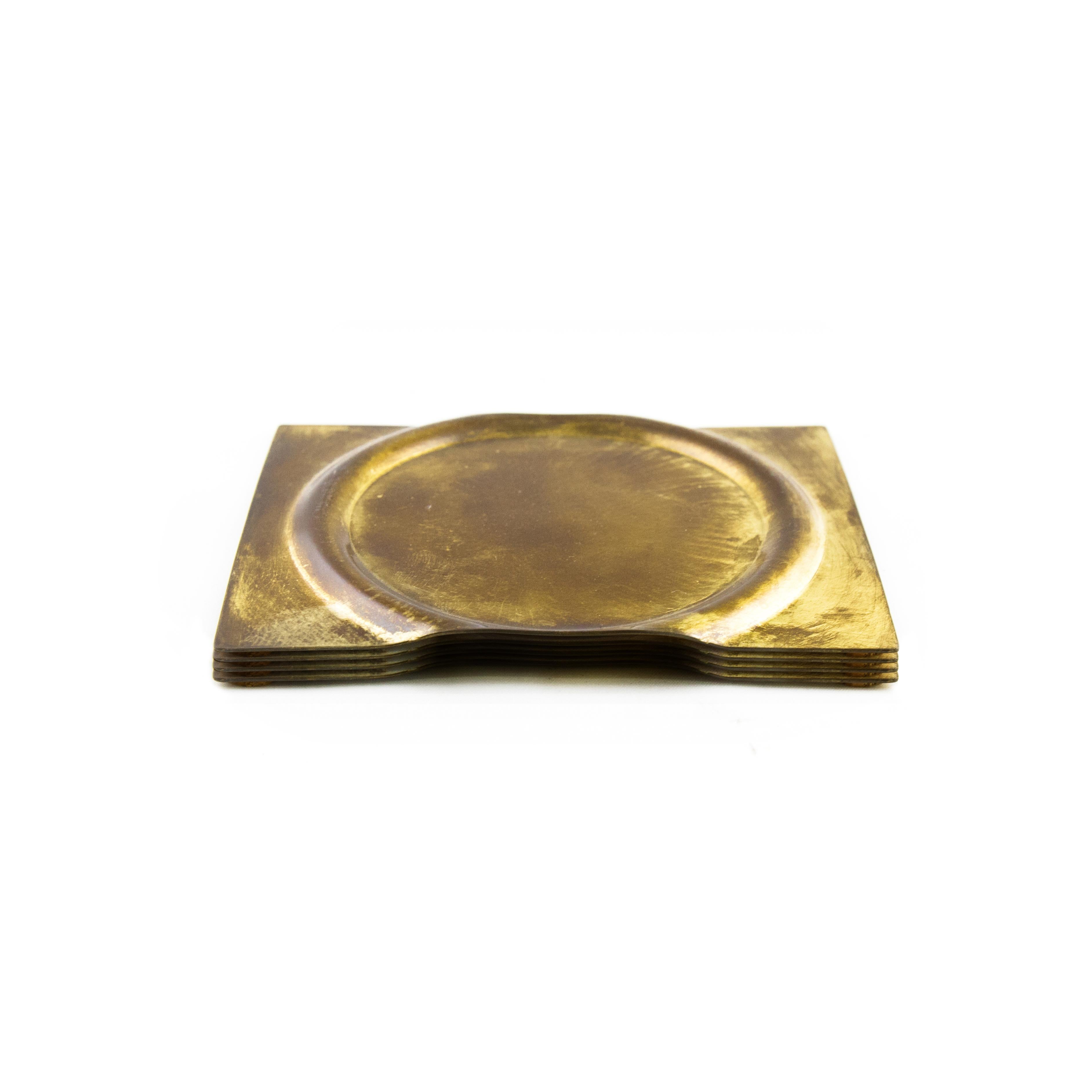 Set of 4 brass coasters by Gentner Design
Dimensions: D 12 x W 9.5 cm
Materials: dull tarnished brass

Hand-formed from a sheet of brass, emphasizing the material’s pliable characteristics expressed through the process of production, each piece