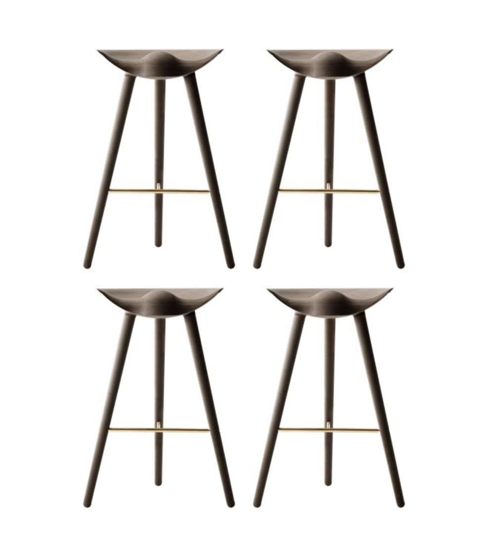 Set of 4 brown oak and brass bar stools by Lassen
Dimensions: H 77 x W 36 x L 55.5 cm
Materials: Oak, Brass

In 1942 Mogens Lassen designed the Stool ML42 as a piece for a furniture exhibition held at the Danish Museum of Decorative Art. He took