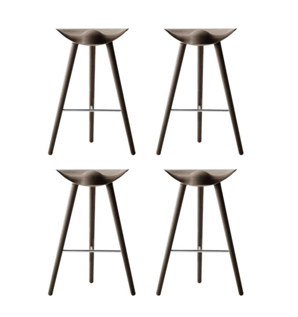 Set of 4 ML 42 brown oak and stainless steel bar stools by Lassen.
Dimensions : H 77 x W 36 x L 55.5 cm.
Materials : Oak, stainless steel.

In 1942 Mogens Lassen designed the stool ML42 as a piece for a furniture exhibition held at the Danish Museum