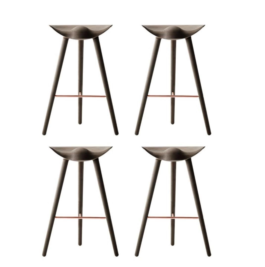 Set Of 4 Brown Oak and Copper Bar Stools by Lassen
Dimensions: H 77 x W 36 x L 55.5 cm.
Materials: oak, brass.

In 1942 Mogens Lassen designed the Stool ML42 as a piece for a furniture exhibition held at the Danish Museum of Decorative Art. He took