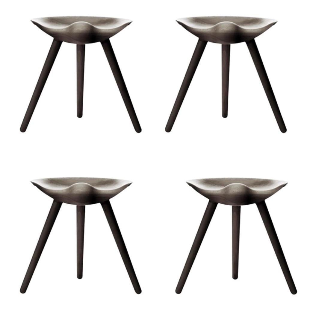 Set of 4 brown oak stools by Lassen
Dimensions: H 48 x W 36 x L 55.5 cm
Materials: Oak

In 1942 Mogens Lassen designed the Stool ML42 as a piece for a furniture exhibition held at the Danish Museum of Decorative Art. He took inspiration from the