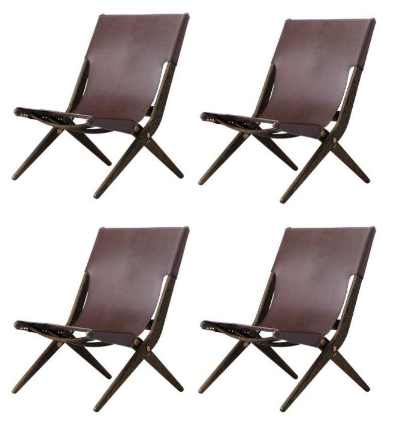 Set of 4 brown stained oak and brown leather Saxe chairs by Lassen
Dimensions: W 60 x D 67 x H 84 cm 
Materials: leather, oak.

Mogens Lassen was perceived as ‘the naughty boy in class’, but he aimed for perfection in each design project. His