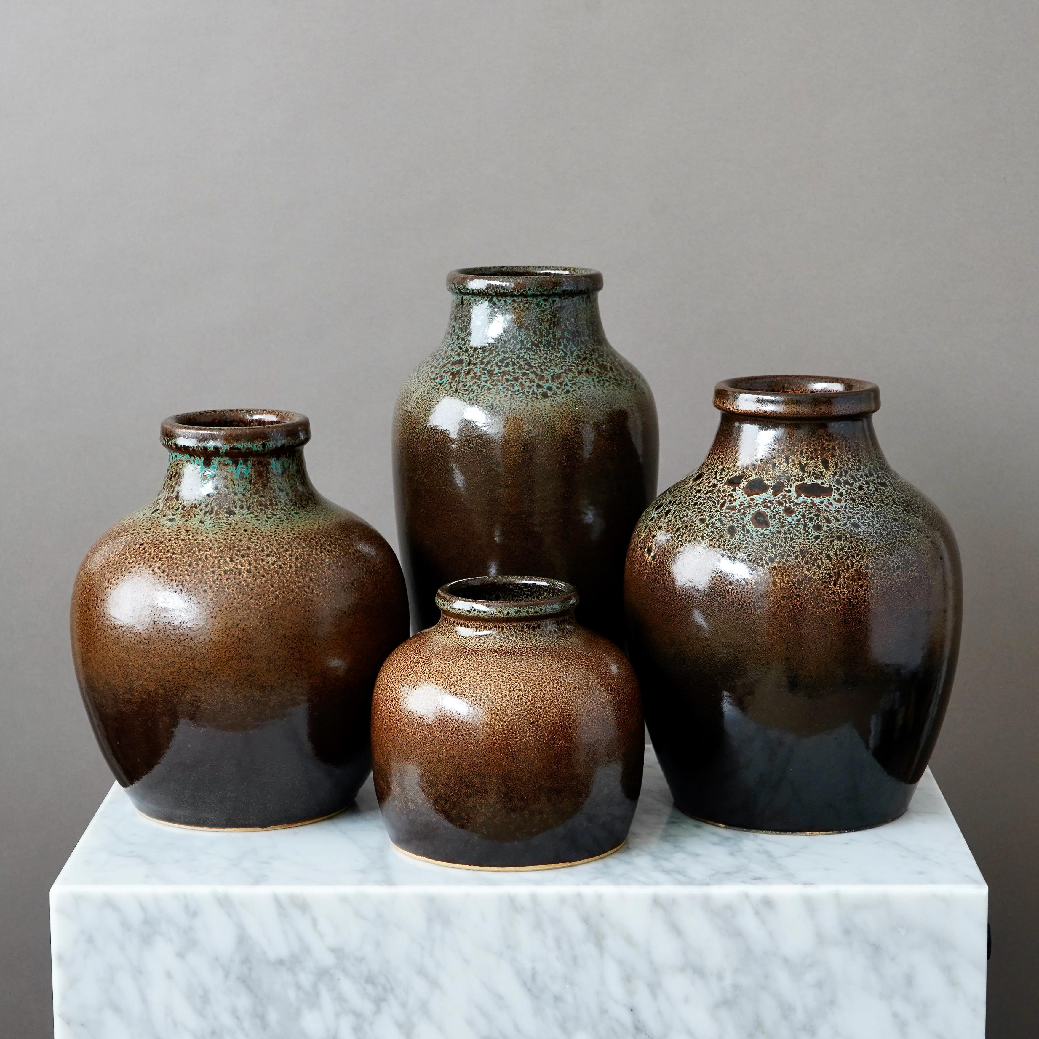 A set of four stoneware vases with amazing 'leopard' glaze. 
Made by Yngve Blixt, in his studio in Höganäs, Sweden, 1974-1975.

Excellent condition. Incised Yngve Blixt, Höganäs.

Yngve Blixt (1920–1981) was one of Sweden’s leading ceramic artists