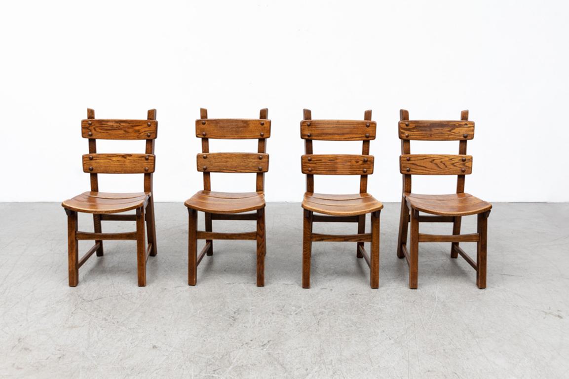 Set of 4 Brutalist style oak ladder back dining chairs. In original condition with visible wear and patina consistent with their age and use. Set price.
