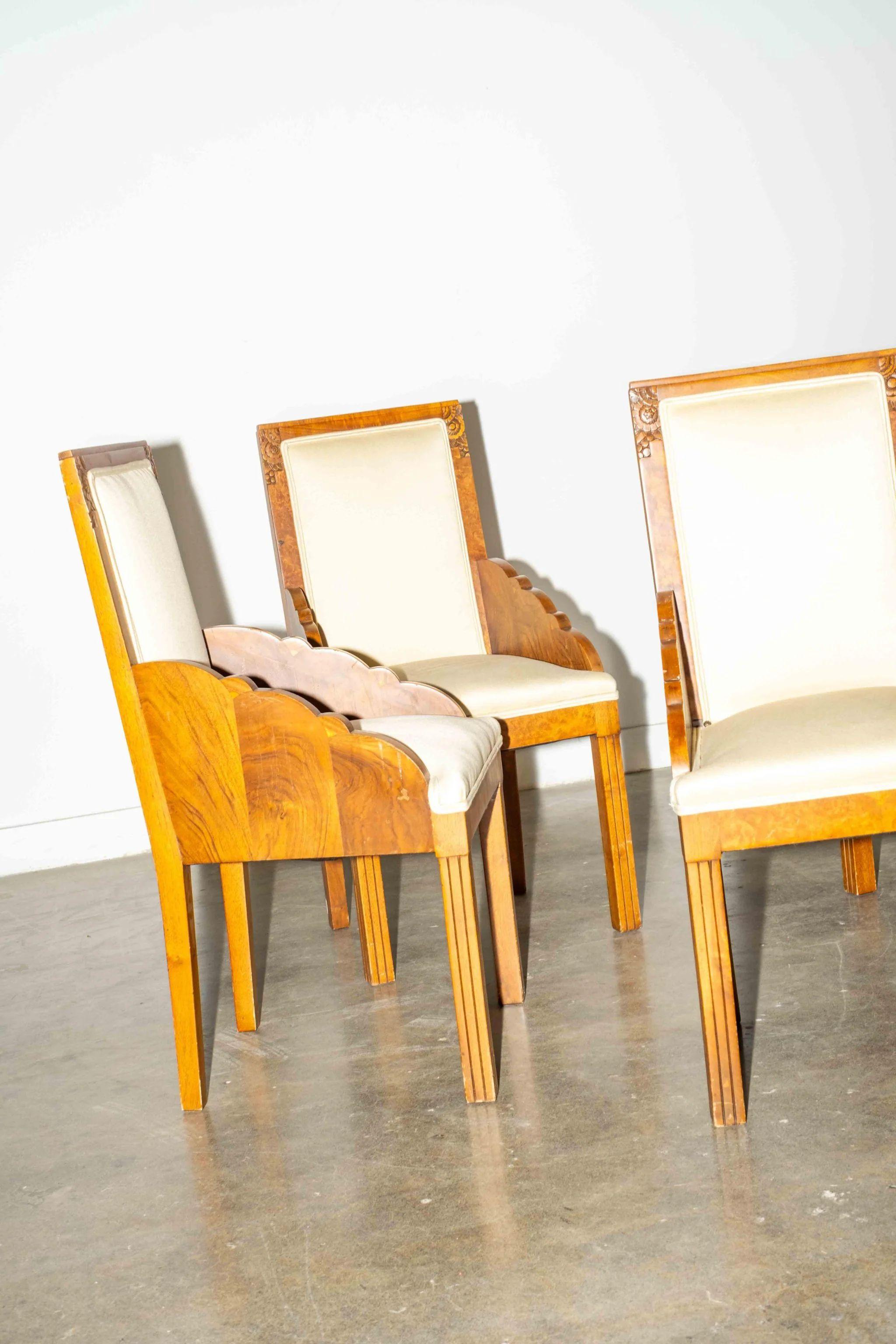 Incredibly elegant detailing - like the glossy burled wood or the playful scalloped-edge - make this set of 4 dining chairs absolute show-stoppers. Some stains on the original satin upholstery, but these are just waiting for a fun fabric refresh