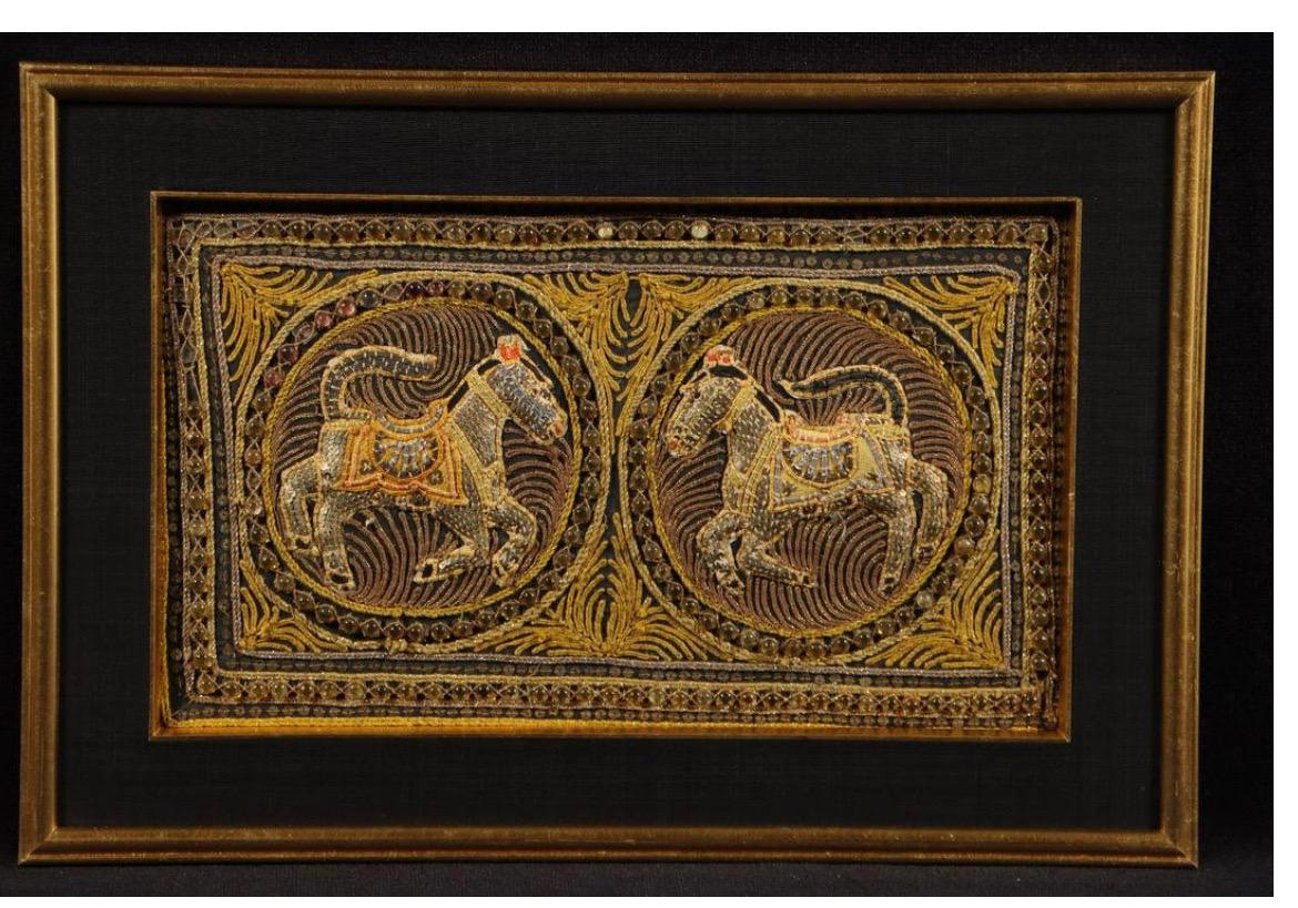 Set of 4 Burmese Kalanga Tapestry each depicting two horses. Elaborate embroidery, richly decorated with incorporated glass beads, metal plates and sequins. Mounted in a gilded wooden frame, back with chain for wall mounting. Highly decorative, and