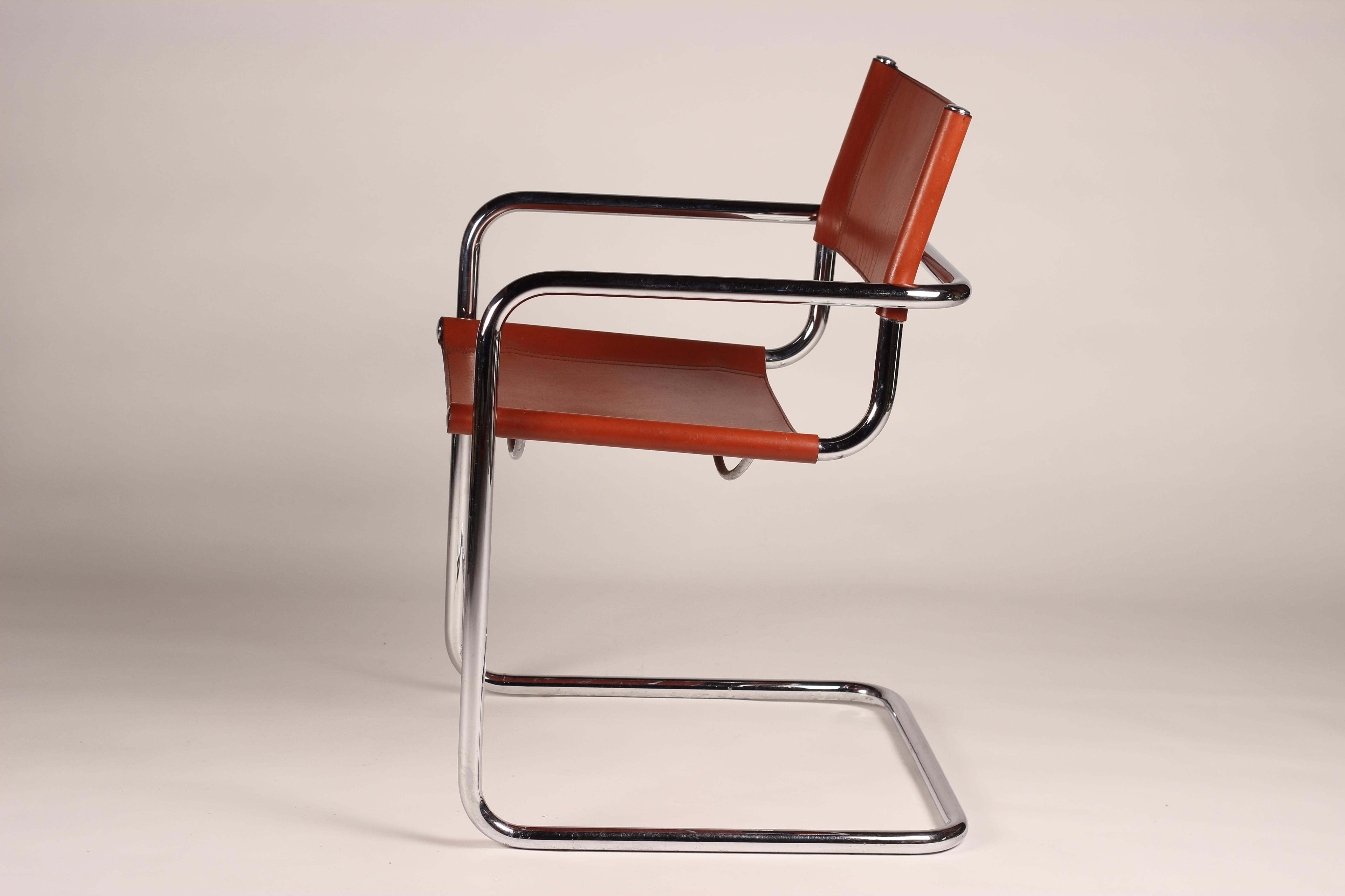 A set of four Italian leather and chrome cantilevered armchairs in the style of Mart Stam or Marcel Breuer. Designed with the load bearing cantilevered steel chromed frame that with have come to expect from design icons Marcel Breuer and Mart Stam.