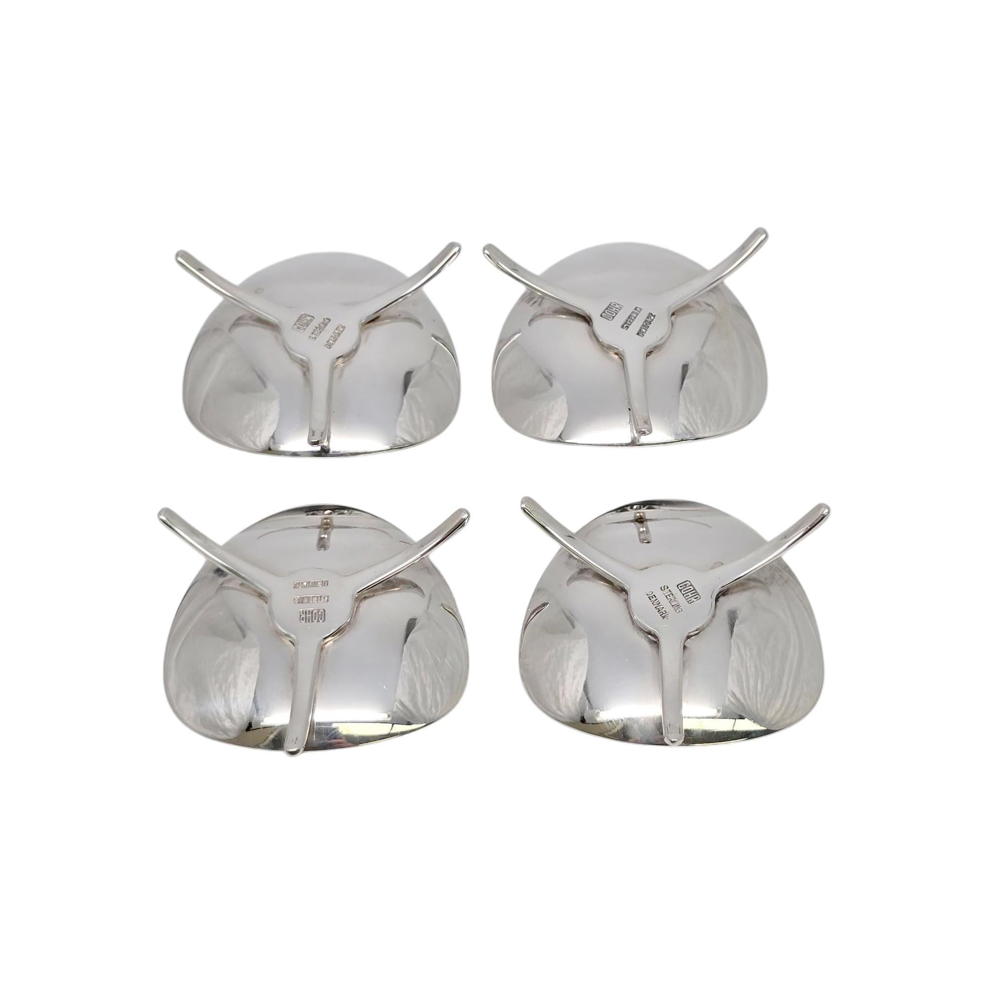 A set of 4 sterling silver small taper candlestick holders by Carl Cohr of Denmark.

No monogram or engraving

A simple and classic modernist design featuring a triangular base on 3 legs. Meant for thin candles.

Measures approx 2