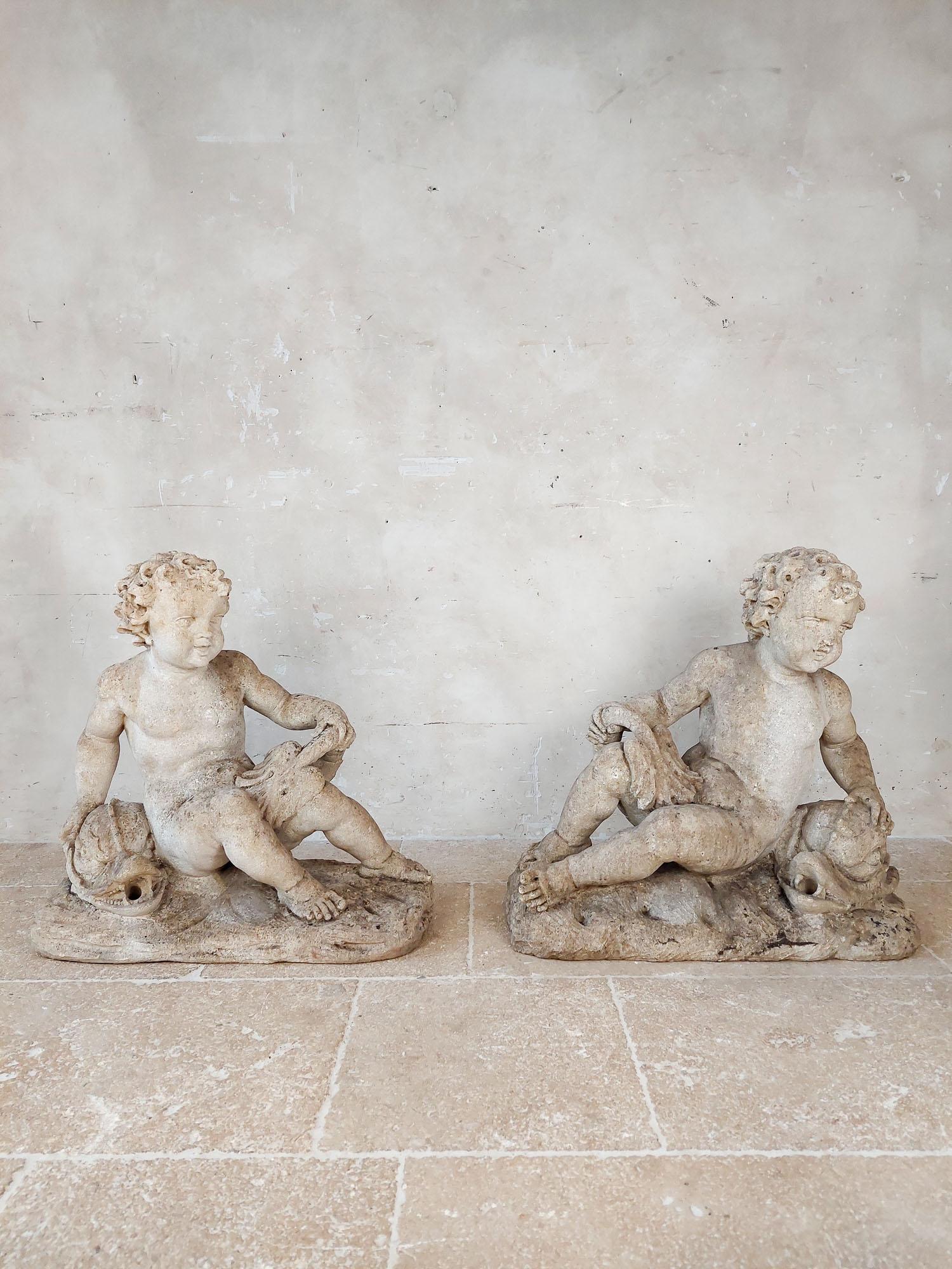 Set of 4 carved limestone fountain putti seated with dolphins For Sale 4