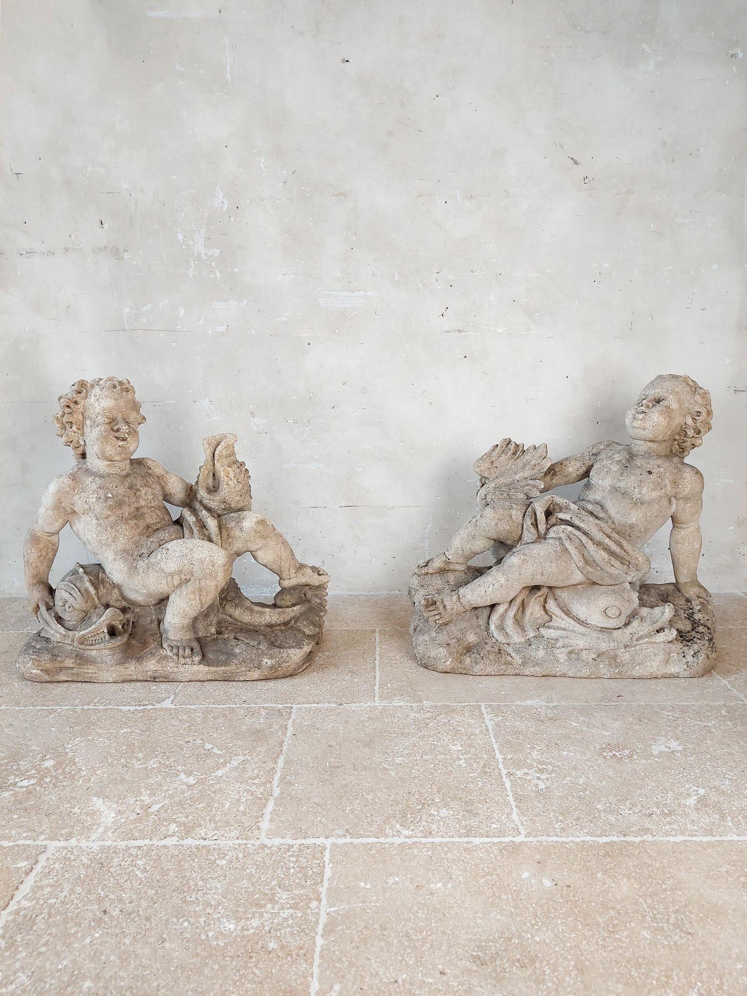French Set of 4 carved limestone fountain putti seated with dolphins For Sale