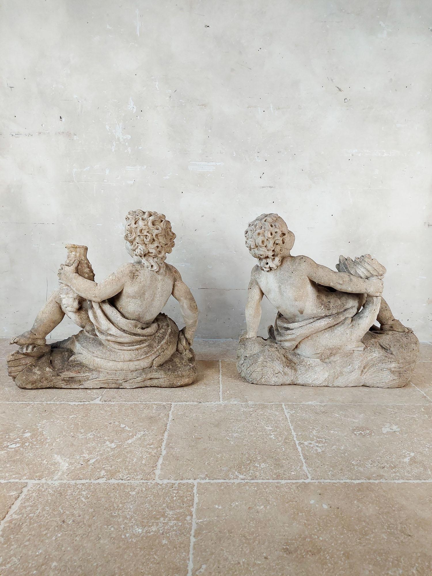 Set of 4 carved limestone fountain putti seated with dolphins For Sale 1