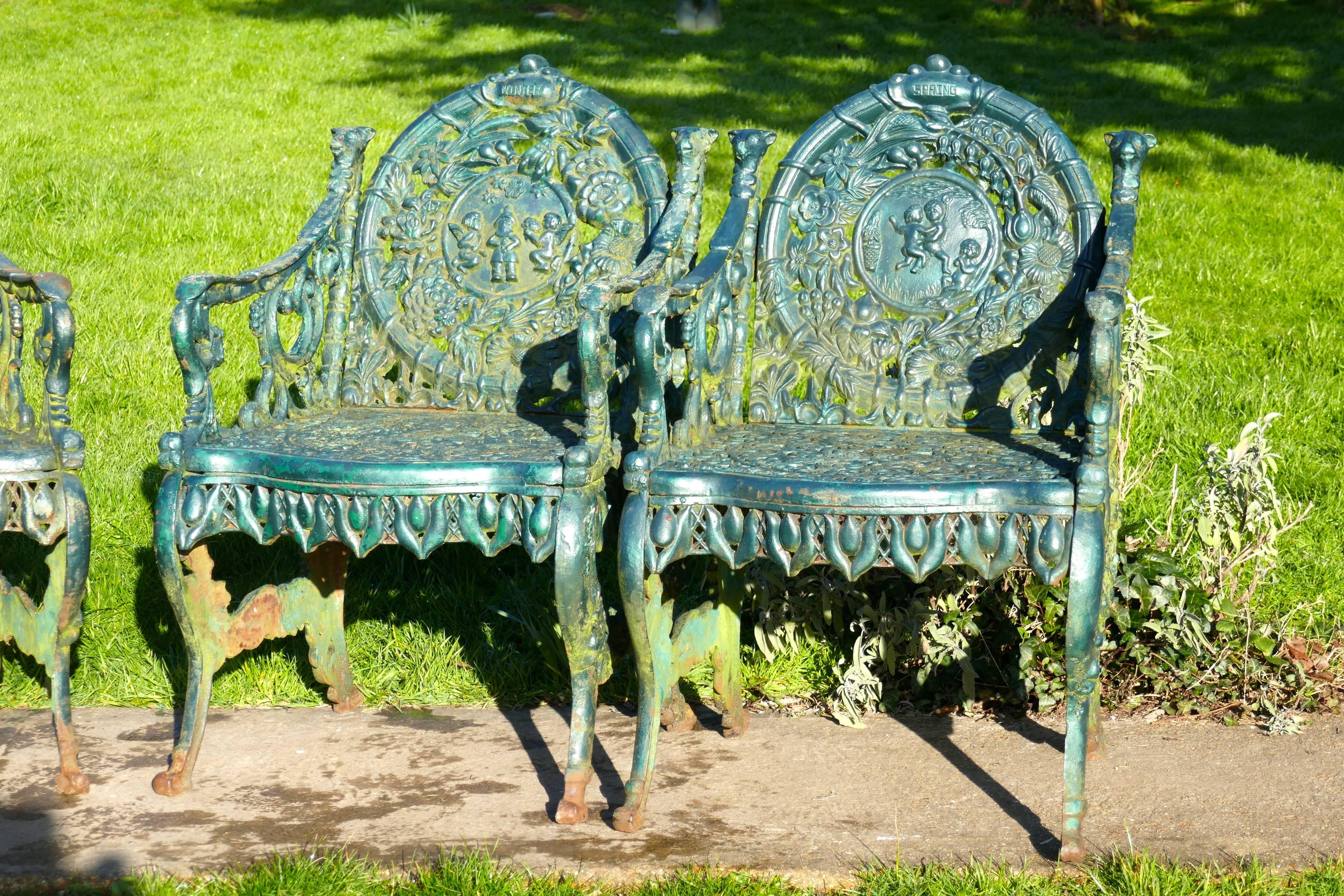 Mid-20th Century Set of Four Cast Iron Garden Armchairs, Four Seasons Plaques on the Backs
