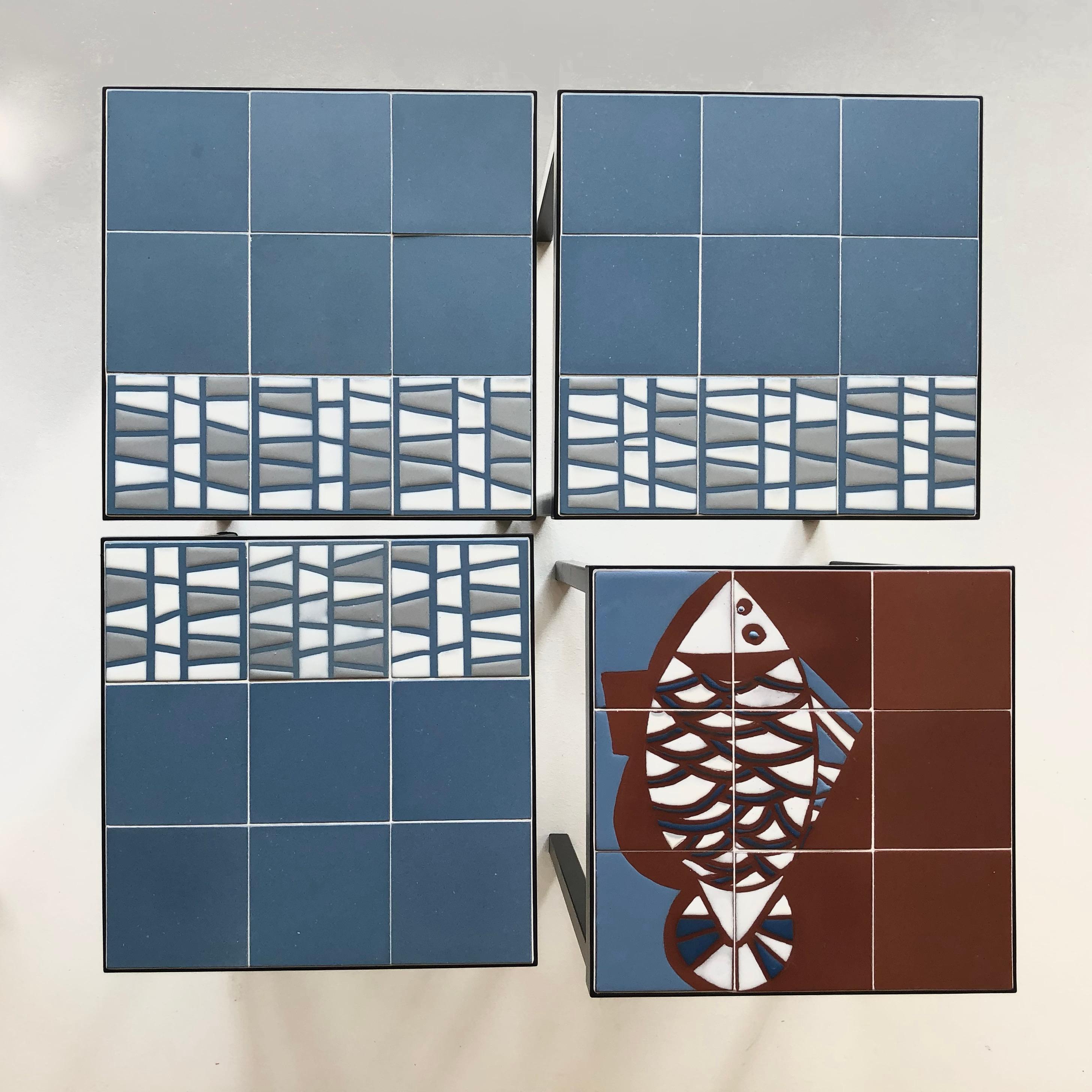 Exceptional set of four ceramic side tables combining geometric and animal decor.
The enamelling in relief brings animation ans sophistication to this joyful realisation which characterise the early work of Roger Capron.
The blue and red terracotta