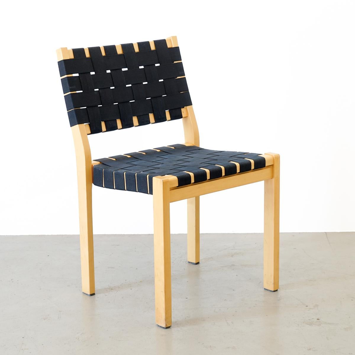 Original set of 4 chairs model 611 designed by Alvar Aalto in 1929 for Artek, Finland. The seat and backrest formed by interweaved bands of black linen and the linear frame made of birchwood make the chair to a distinctive design. This chair