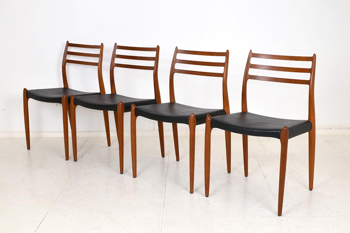 Set of 4 chairs in solid teak and original black leather. With manufacturer’s tag.
In very good condition, with light traces of use.
Dimensions: 48 x 52 cm. H= 80 cm. Seat= 45 cm.

J.L. Moller, a Danish manufacturer founded in 1944, is known