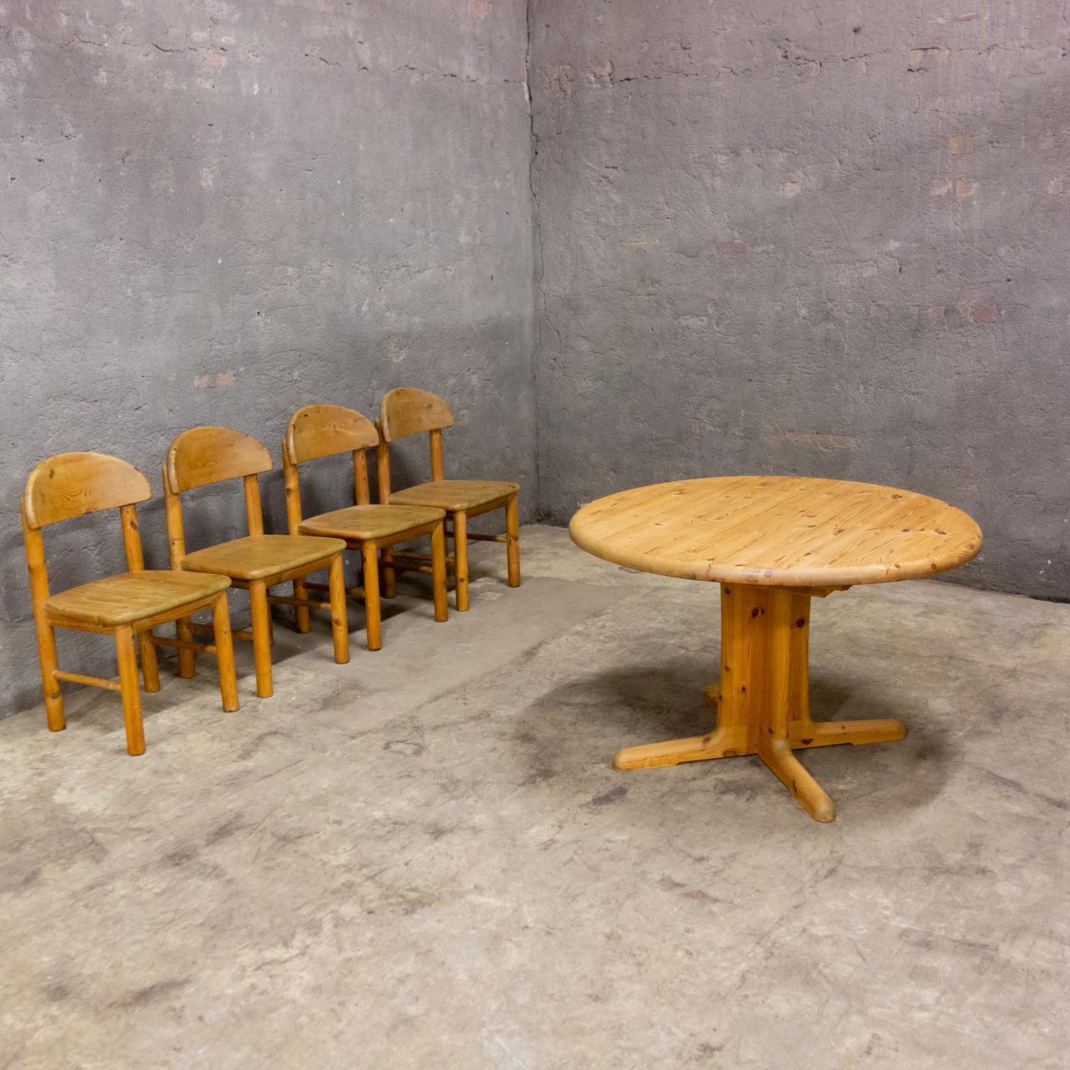 Set of 4 chairs with table by Rainer Daumiller for Hirtshal Sawmill. The set comes from the 70's and is produced in Denmark. The table is removable. Nice detail: the mechanism by which the blade slides in and out of each other by means of gears (see