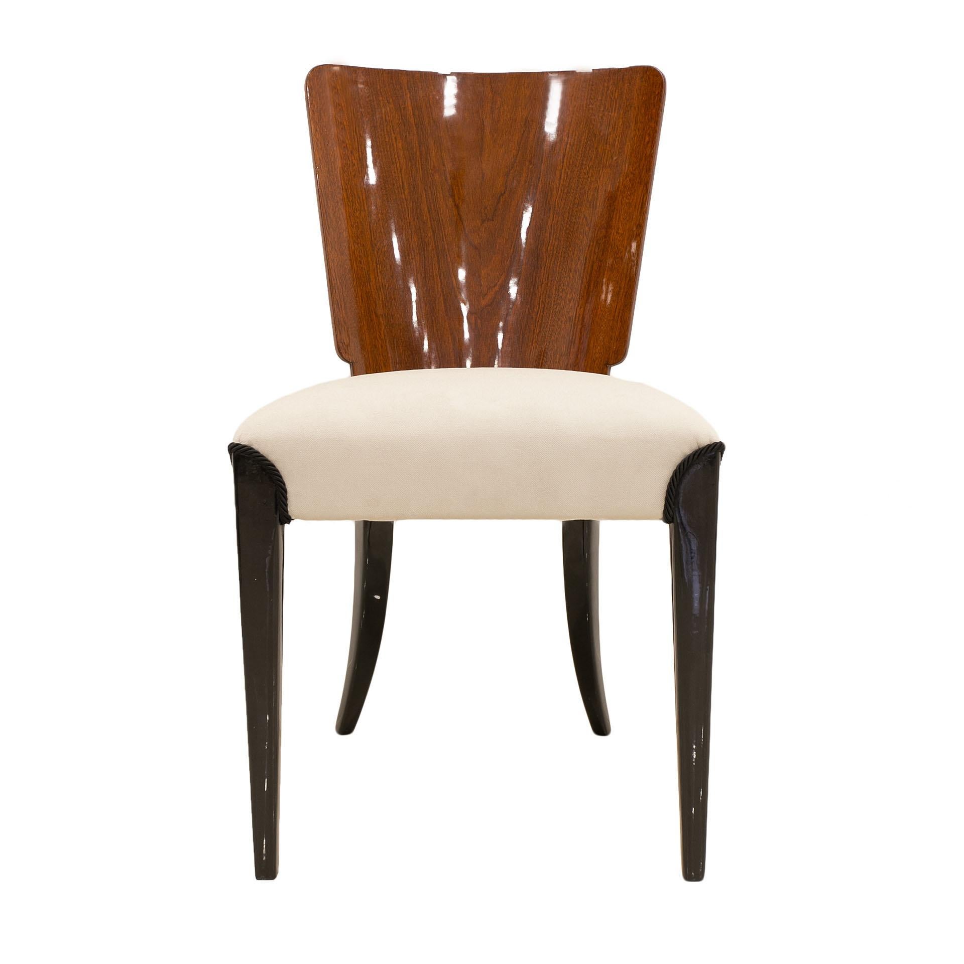 This set of four chairs was designed by Jindrich Halabala, a prominent Czech modernism designer, and produced in Czechoslovakia in the 1930s. The chairs are lightweight, functional, designed with a great sense of form, even though they are nearly 90