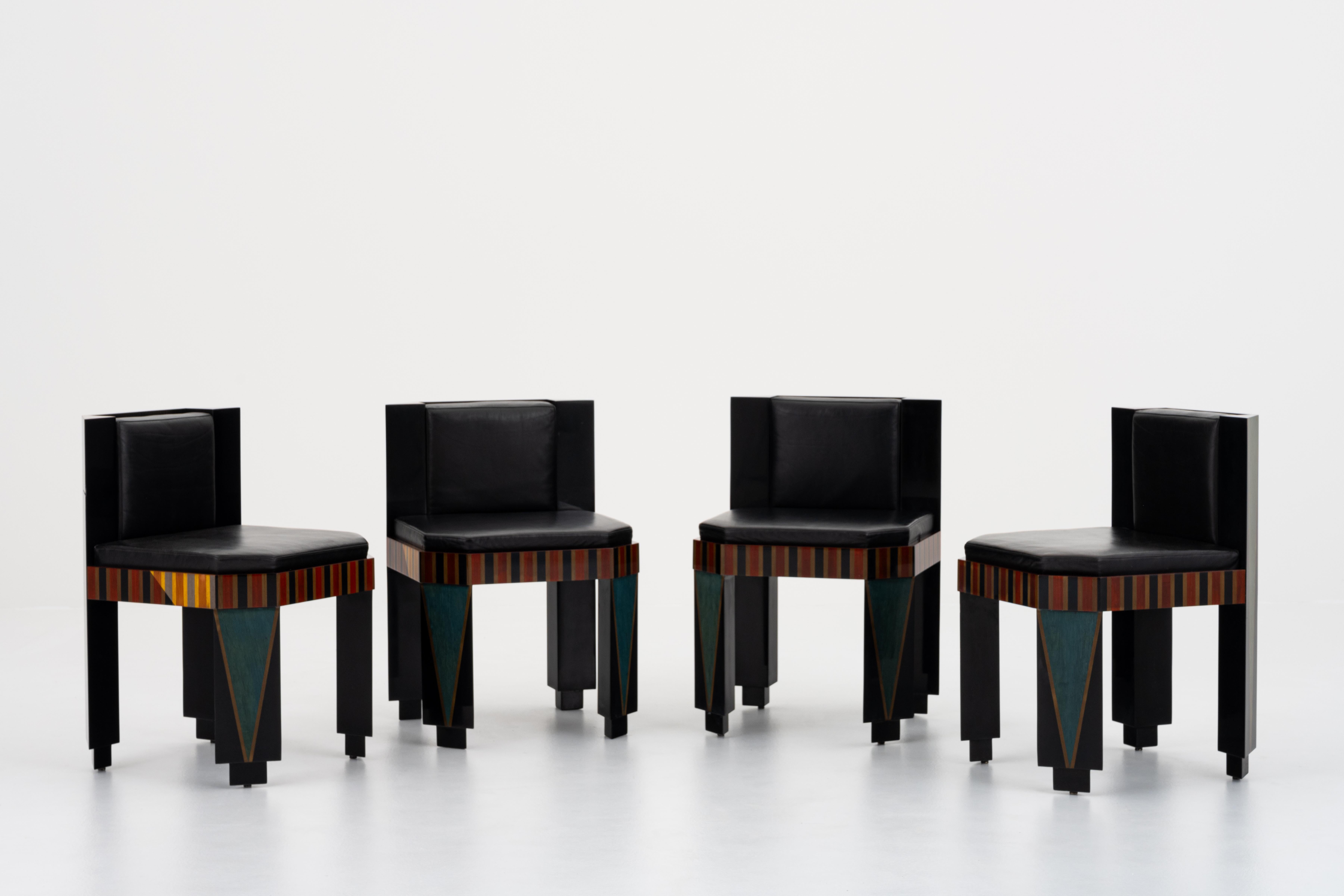 These striking chairs, created by Guy de Rougemont around 1986, exemplify the artist’s singular ability to merge fine art and functional design. Crafted in wood marquetry with a dynamic interplay of geometric patterns and bold color contrasts, they