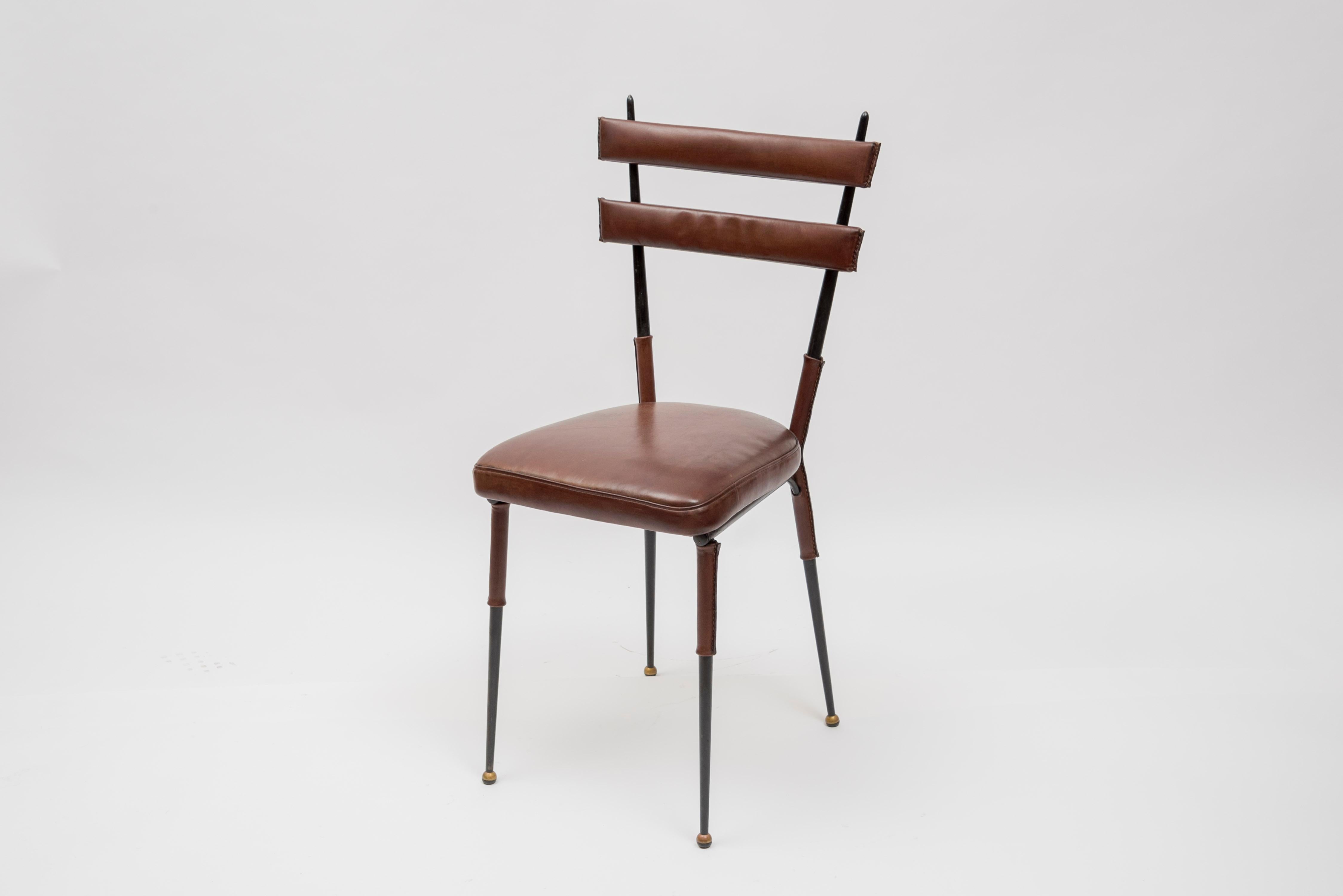Set of 4 chairs in stitched Leather by Jacques Adnet
Leather and metal
1950s
France.