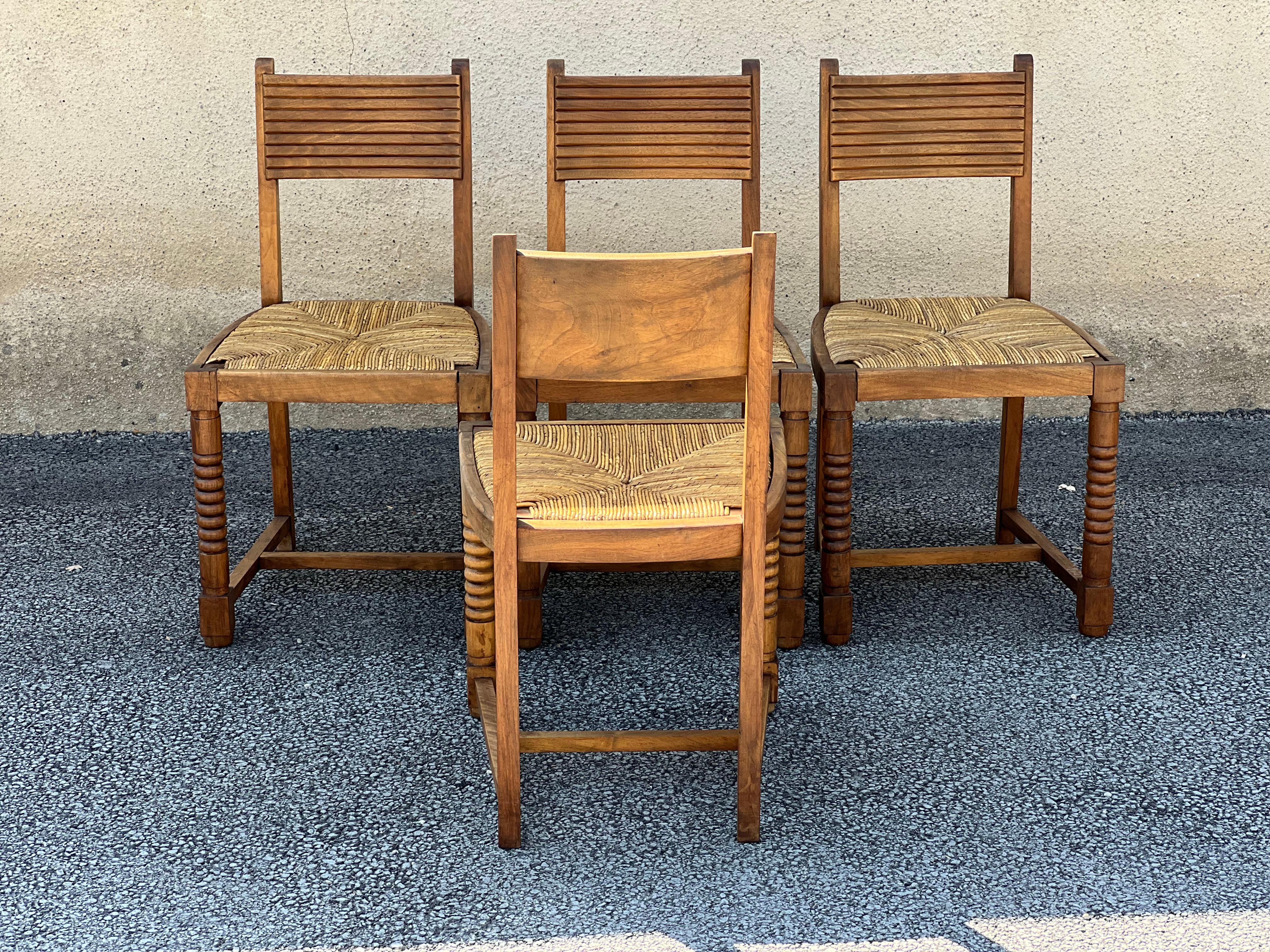 Mid-20th Century Set of 4 Chairs in Walnut and Straw in the Taste of Victor Courtray For Sale