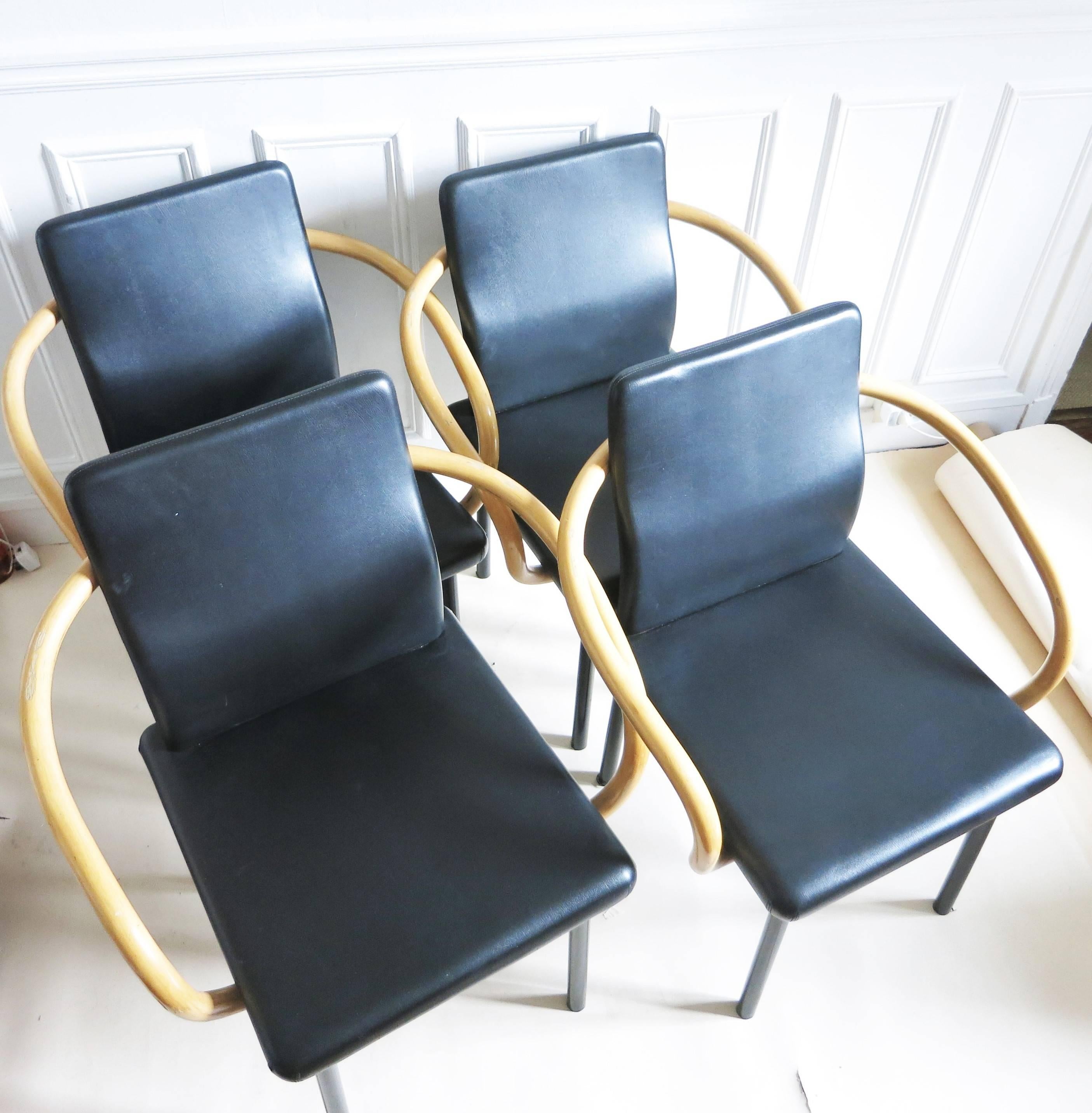 Set of four chairs Mandarin designed by Ettore Sottsass for Knoll International in 1986
Black leather on the polyurethane foam and arm in rattan, 4 feet in black lacquered metal tube.